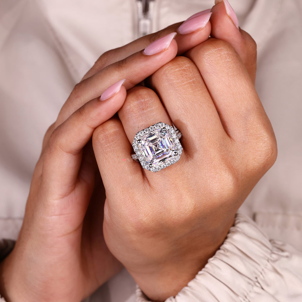 Moissanite halo ring with cathedral setting design.