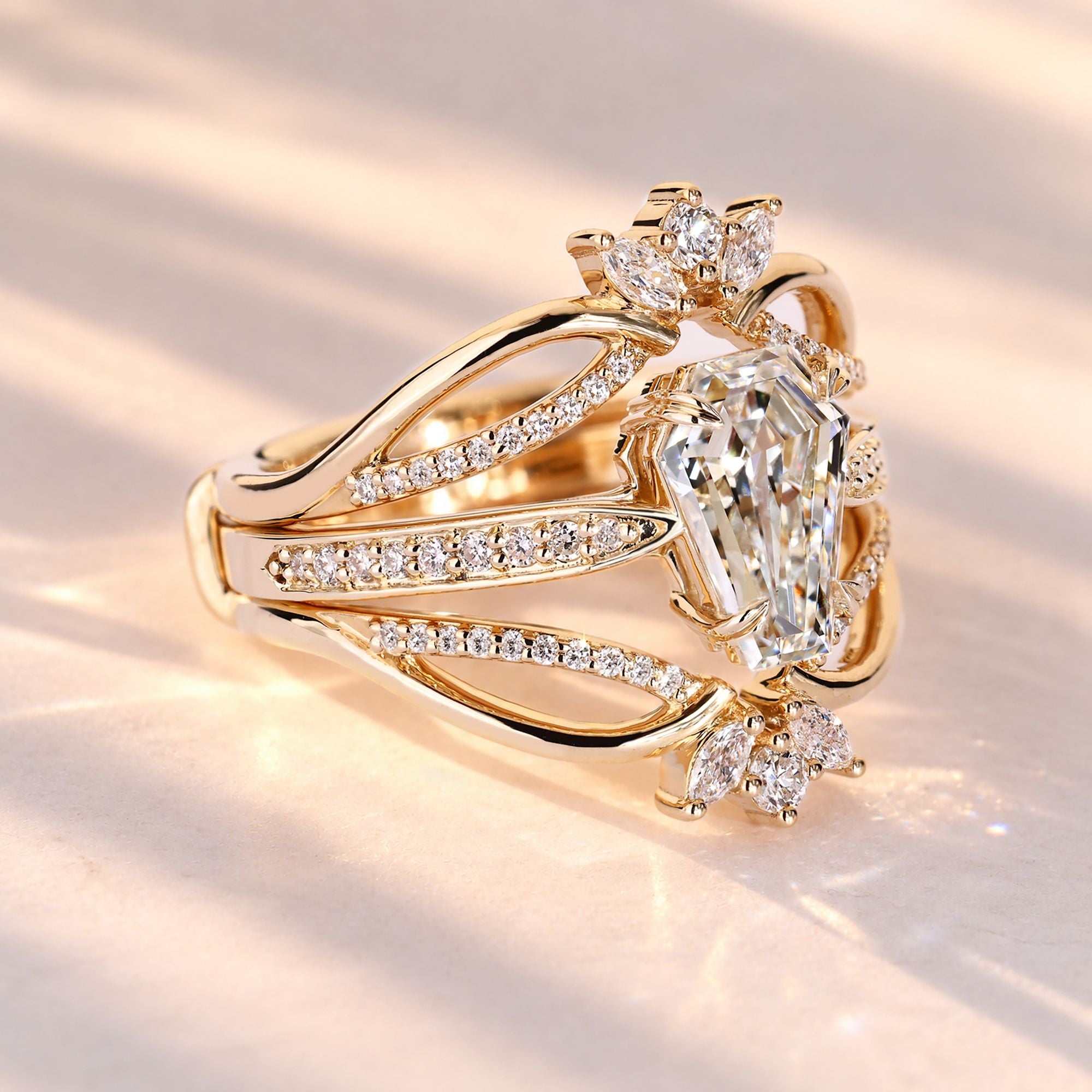 Coffin cut diamond ring with a pinched shank design.
