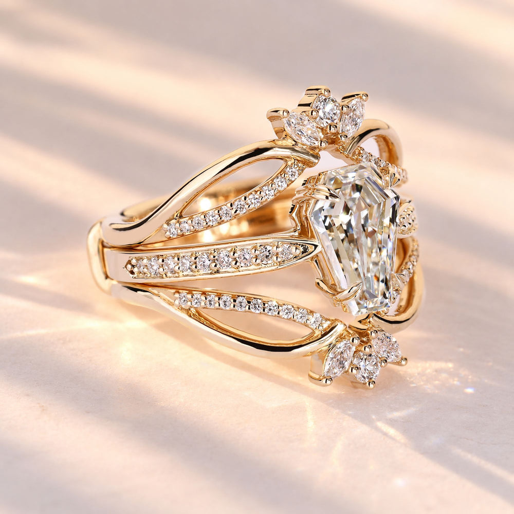 Coffin cut diamond ring with a pinched shank design.
