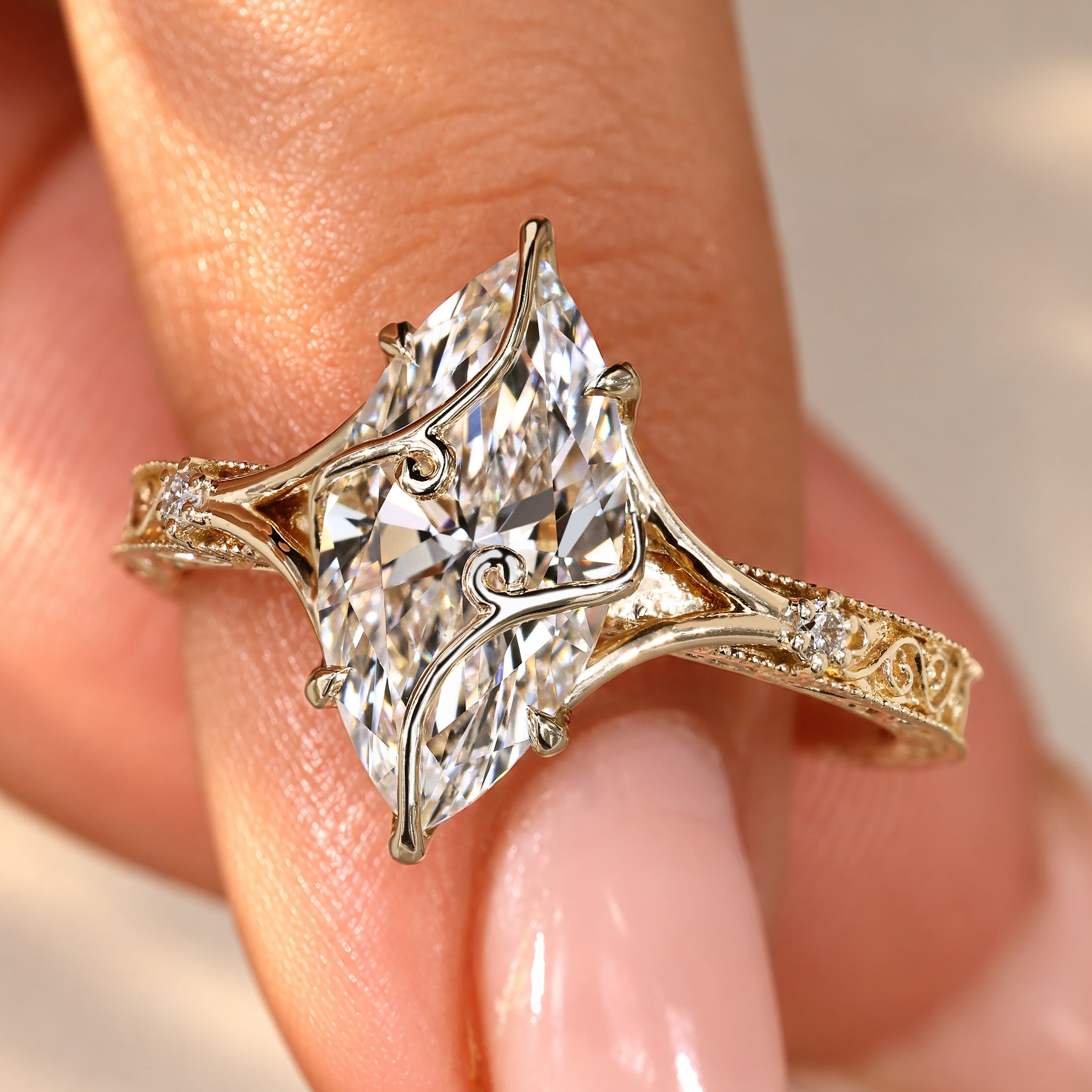 Marquise diamond ring with round cut side stones.
