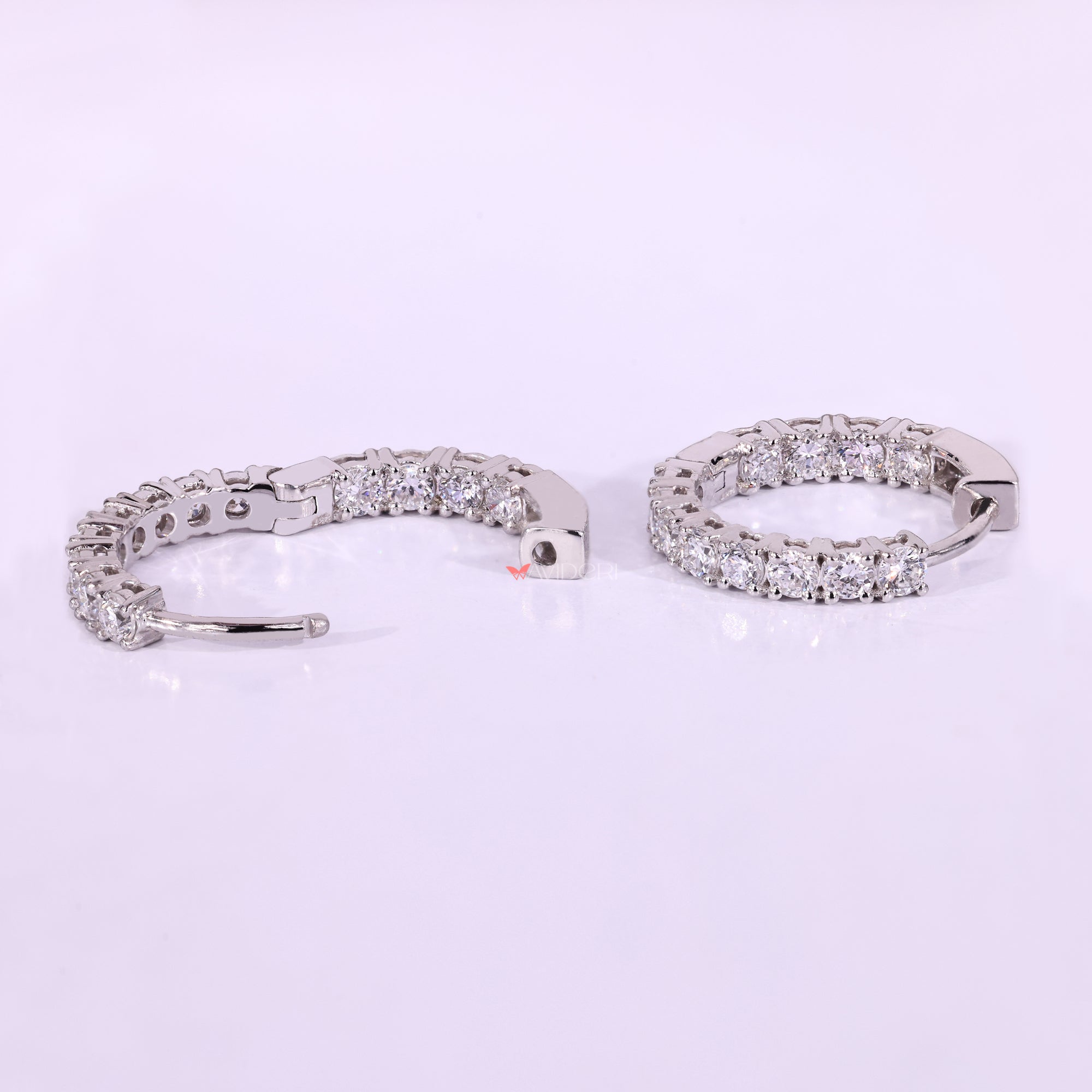 Handmade earrings with round lab grown diamonds.