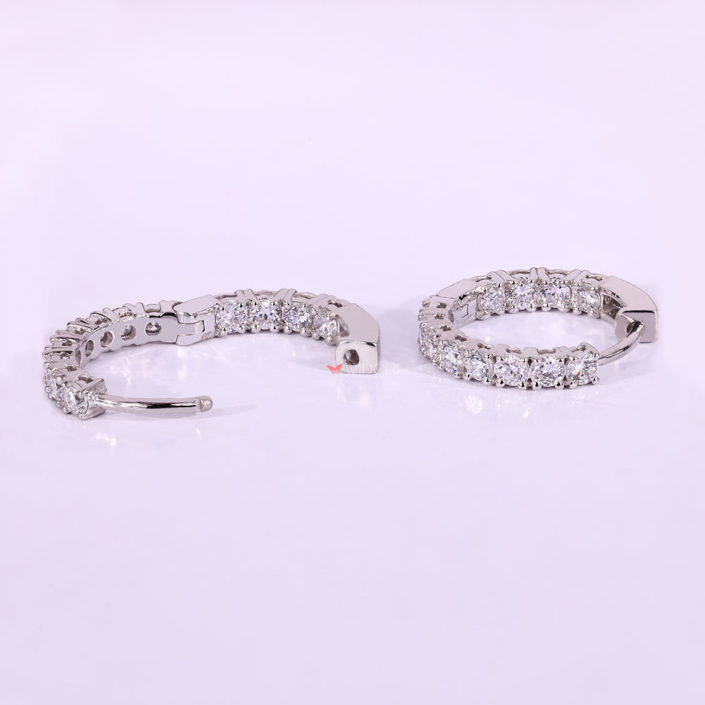 Handmade earrings with round lab grown diamonds.