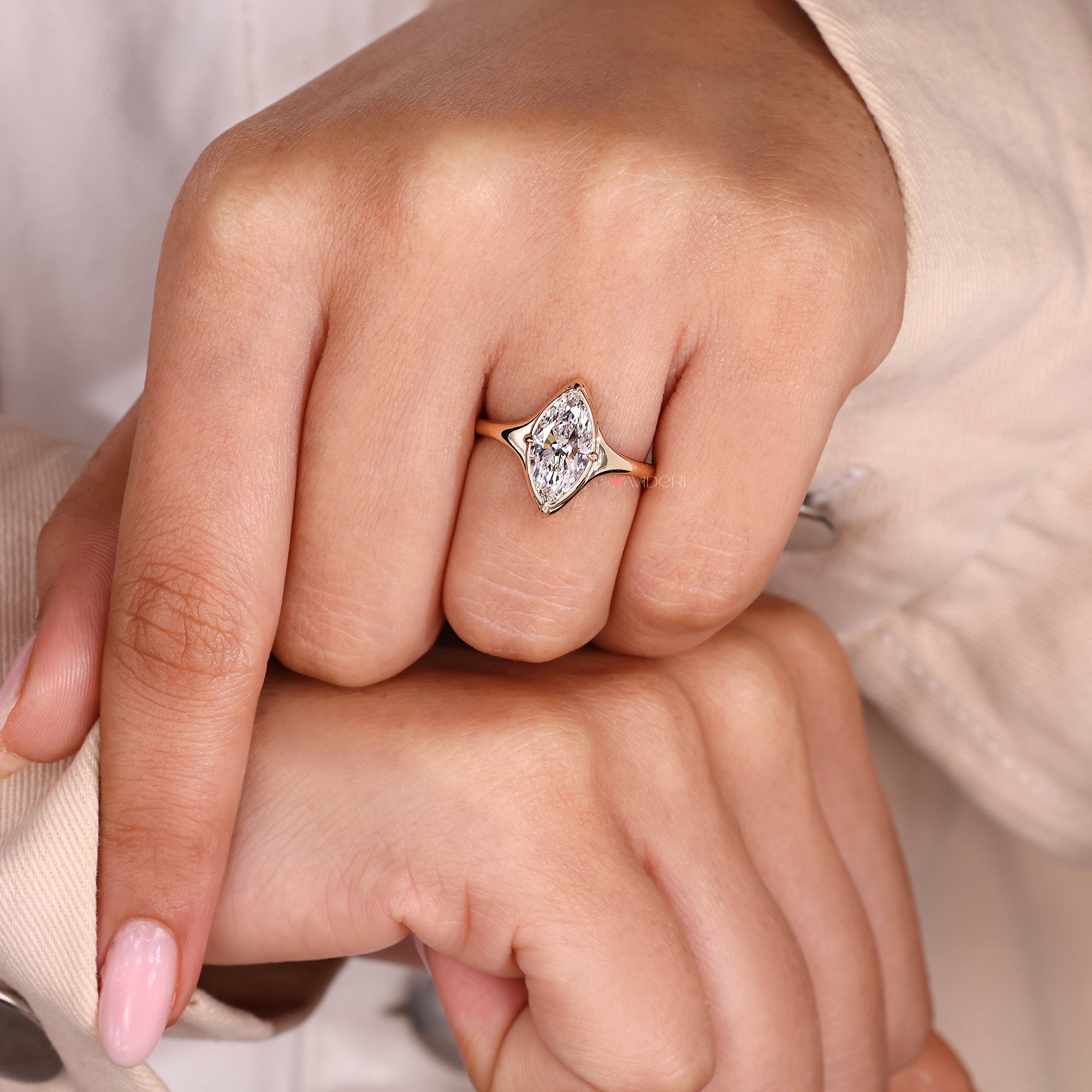Handmade jewelry with marquise cut engagement ring.