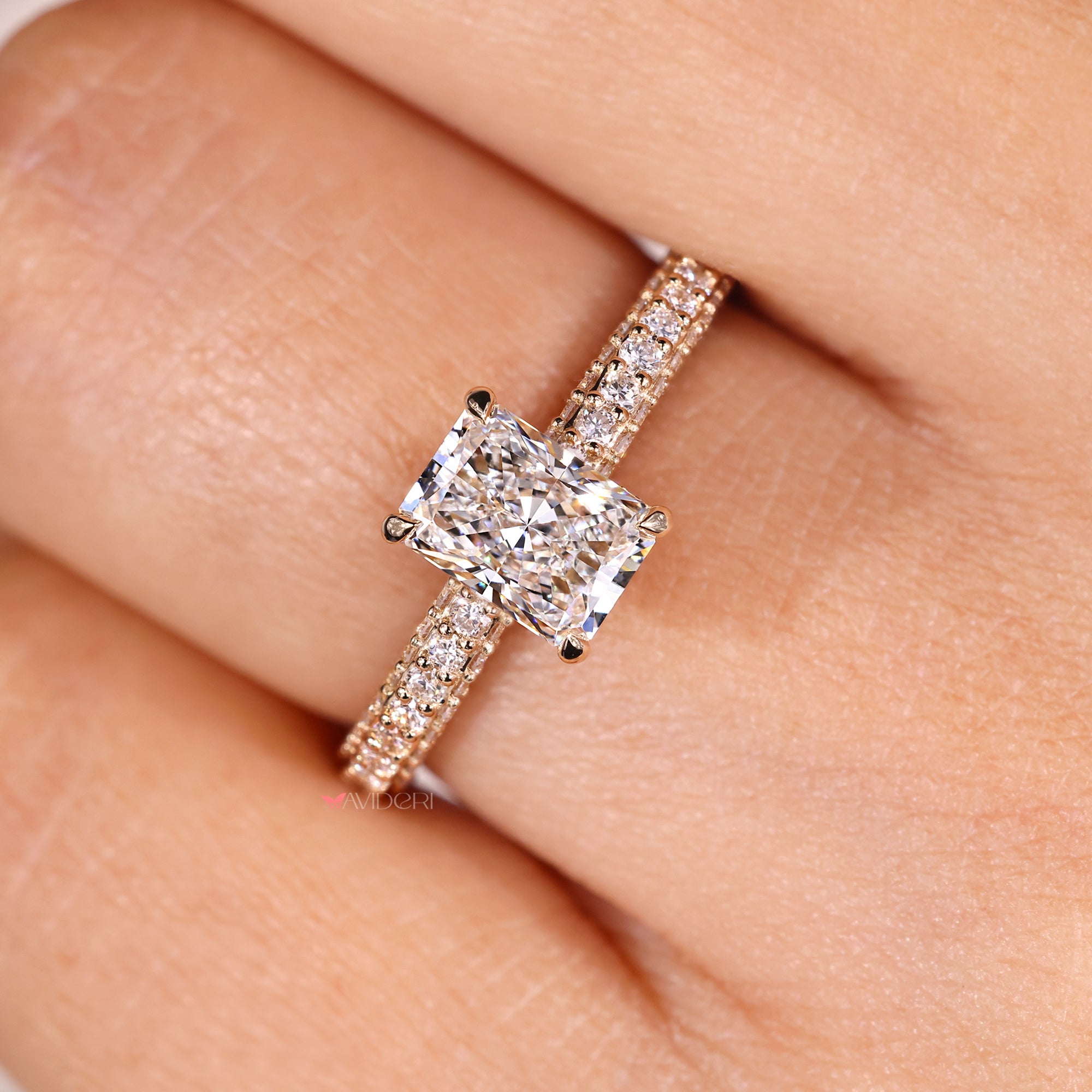 Yellow gold engagement ring with custom radiant stone ring.