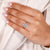 round diamond ring with marquise and round diamond setting in white gold.