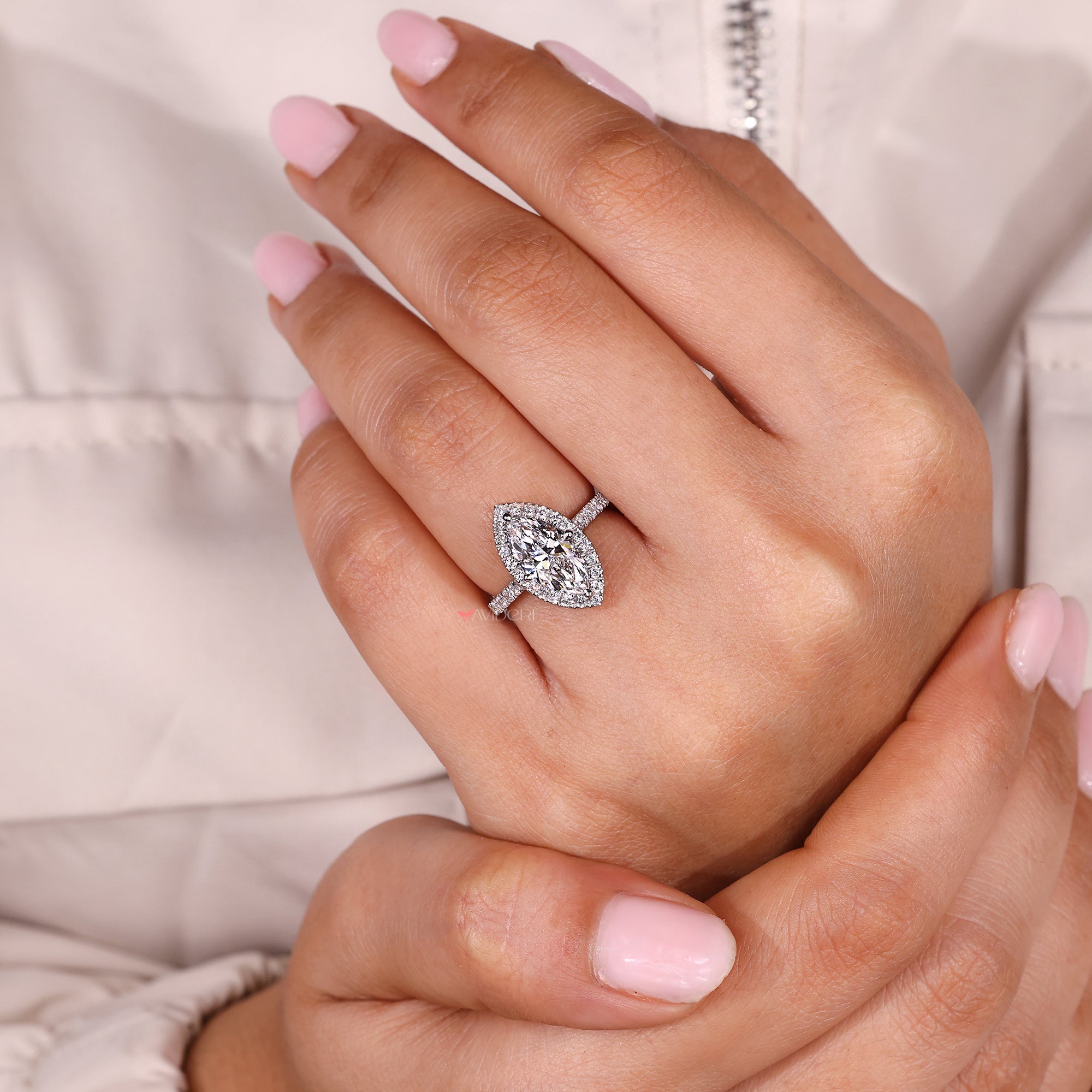 Avideri ring with marquise diamond engagement ring.