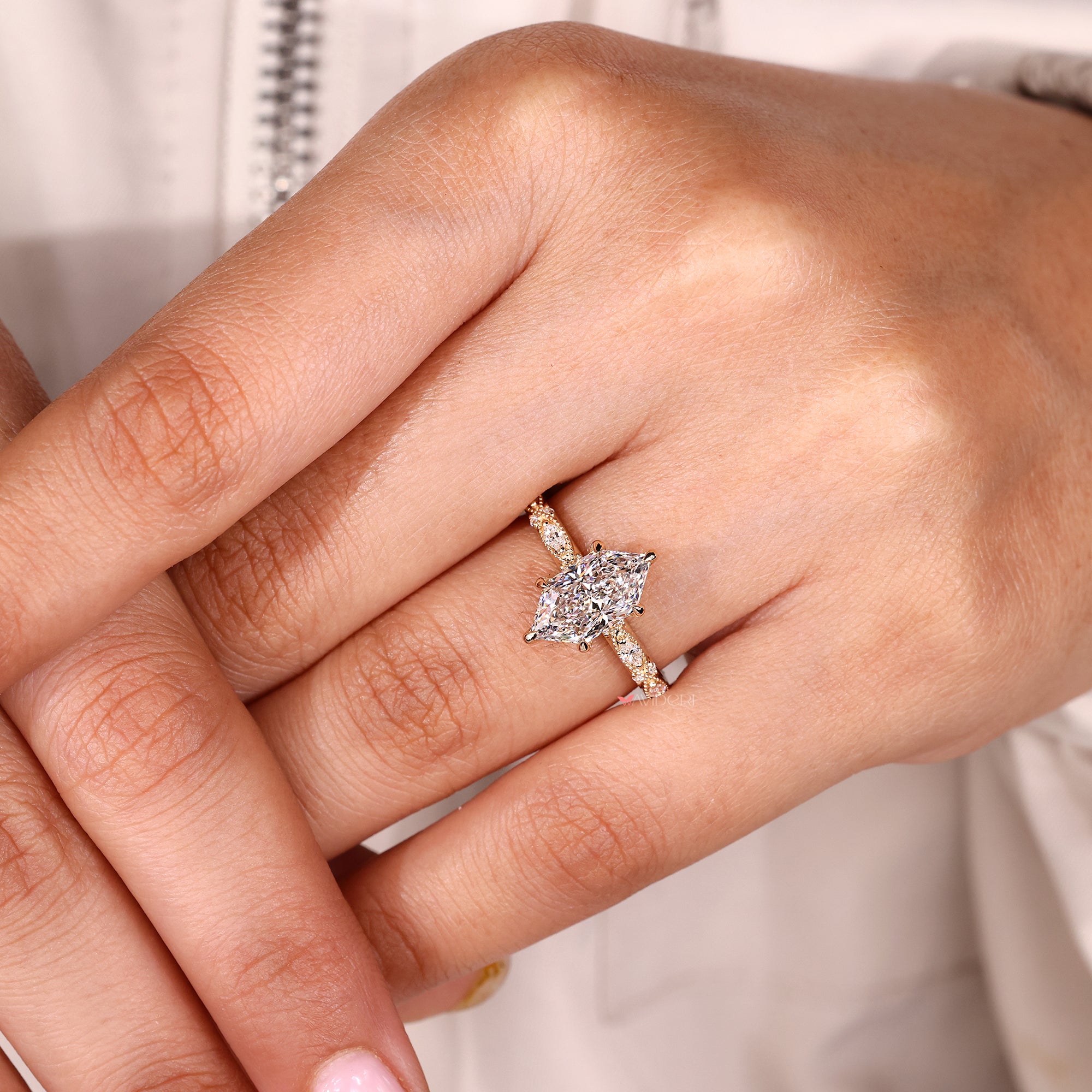 Six claw prong setting on yellow gold engagement ring.