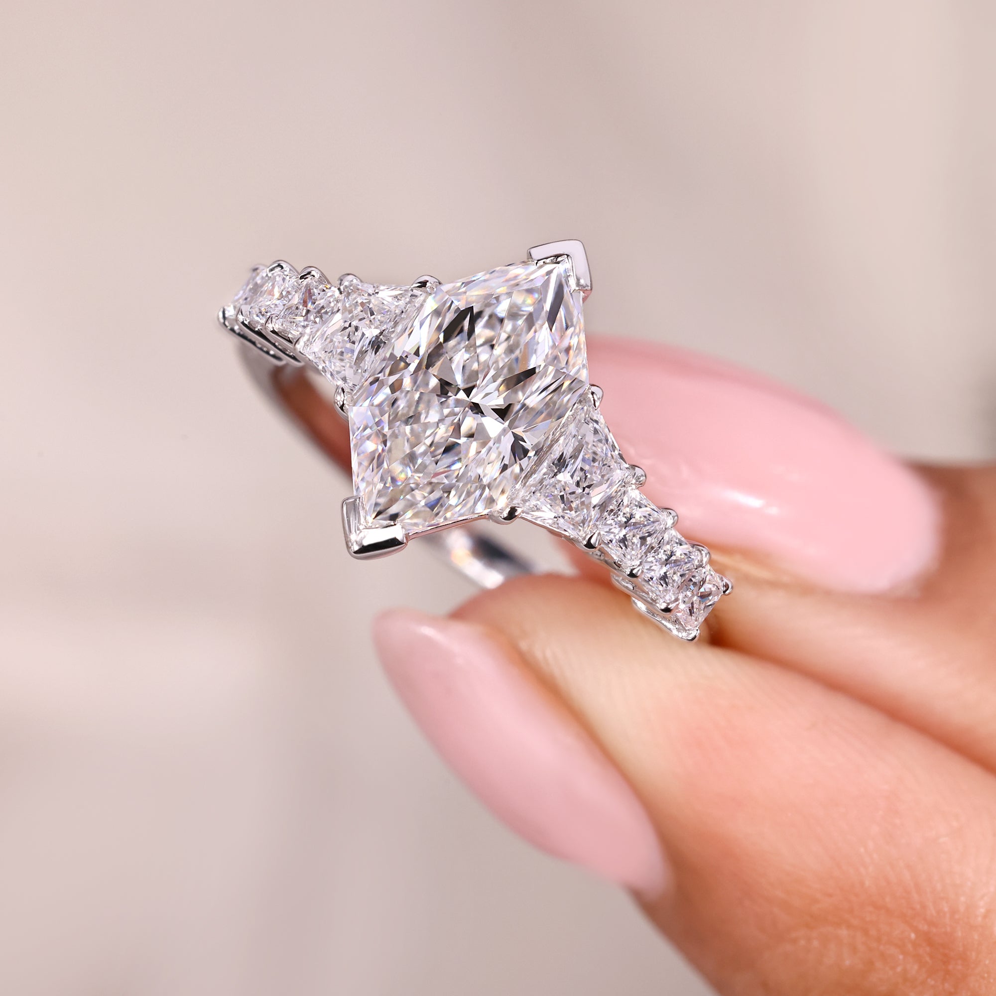 Buy engagement ring with trapezoid side stone.