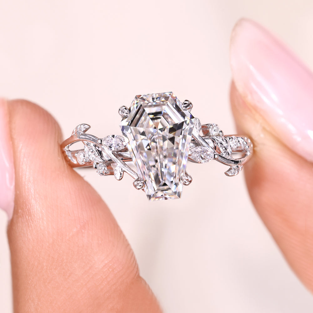 Coffin cut engagement ring with leaf style prong setting.