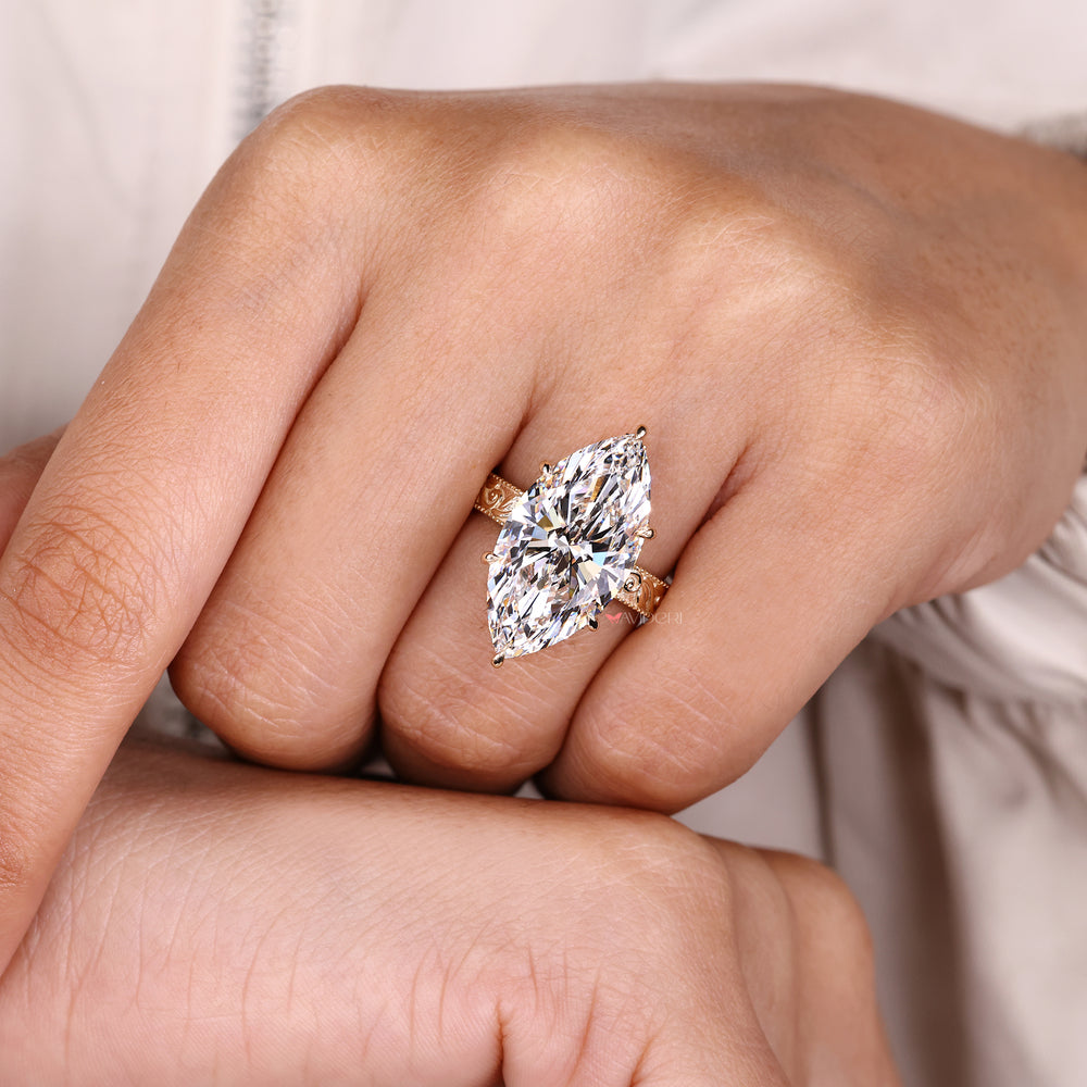 Marquise diamond ring with round diamond halo.