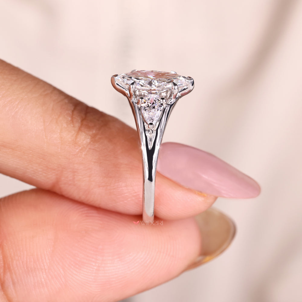 Split shank marquise and pear diamond ring.