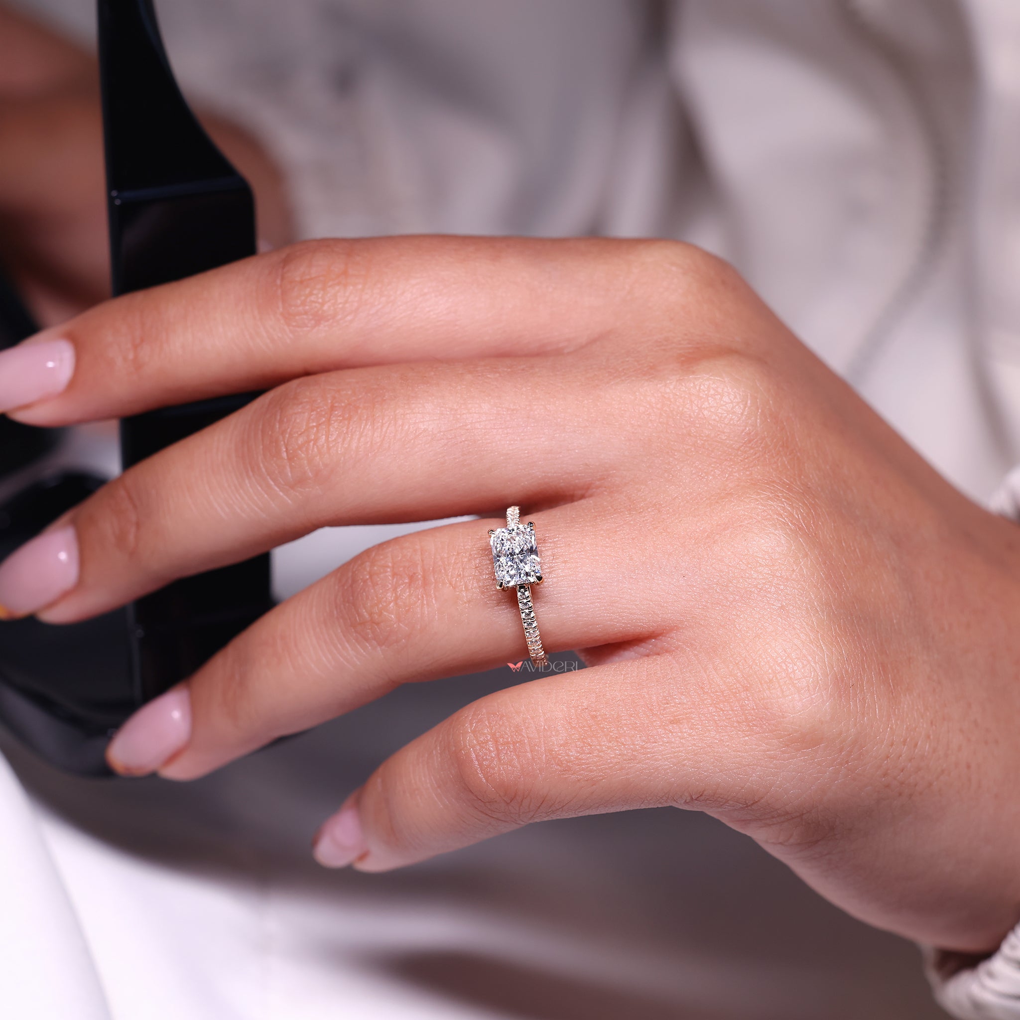 East to west radiant cut diamond ring setting.