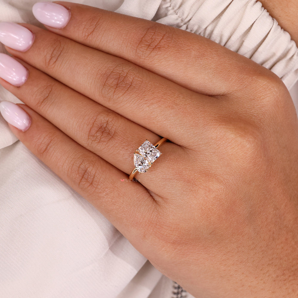 Radiant diamond ring paired with a classic toi et moi ring design.
