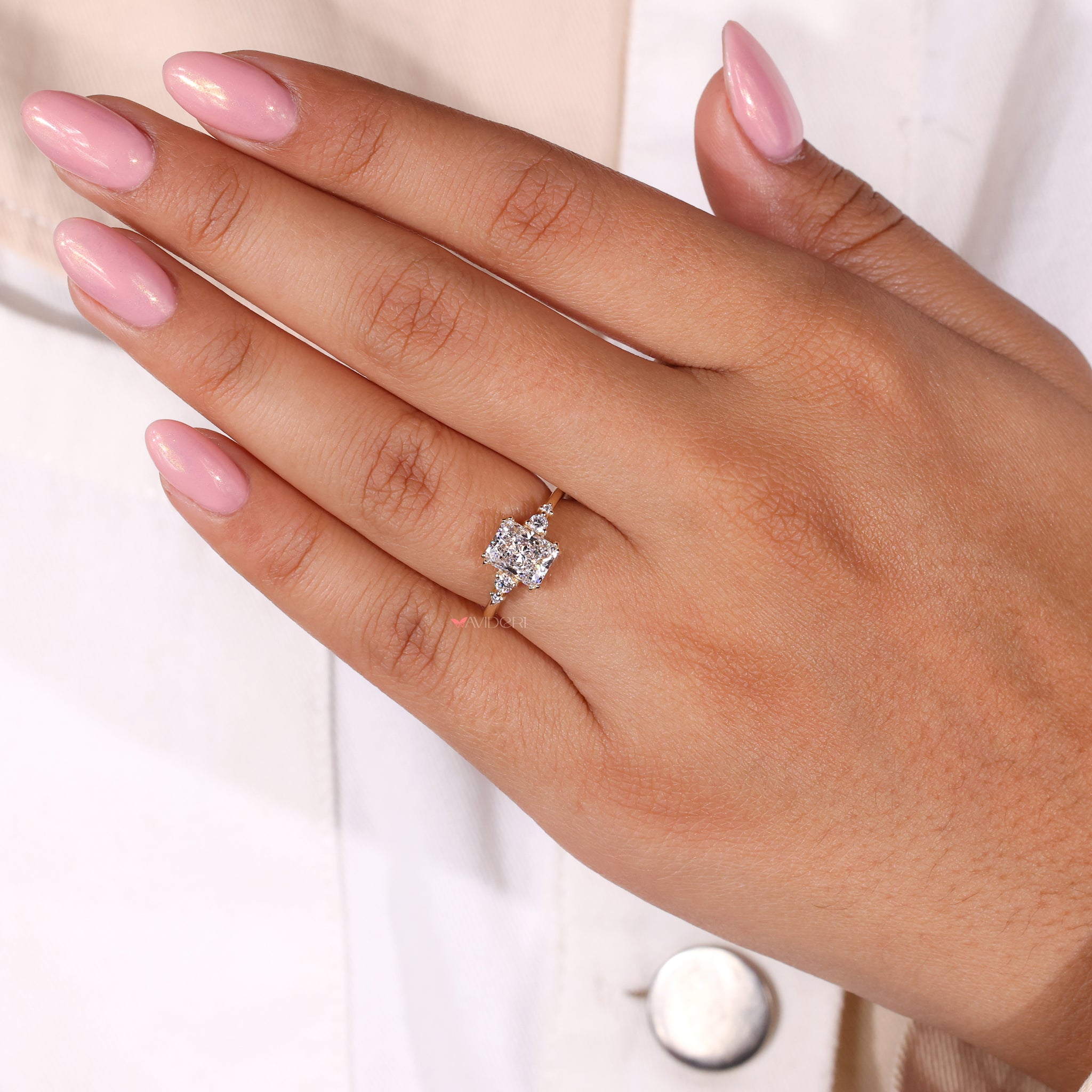 5 stone diamond ring with radiant cut diamonds for a bold statement.

