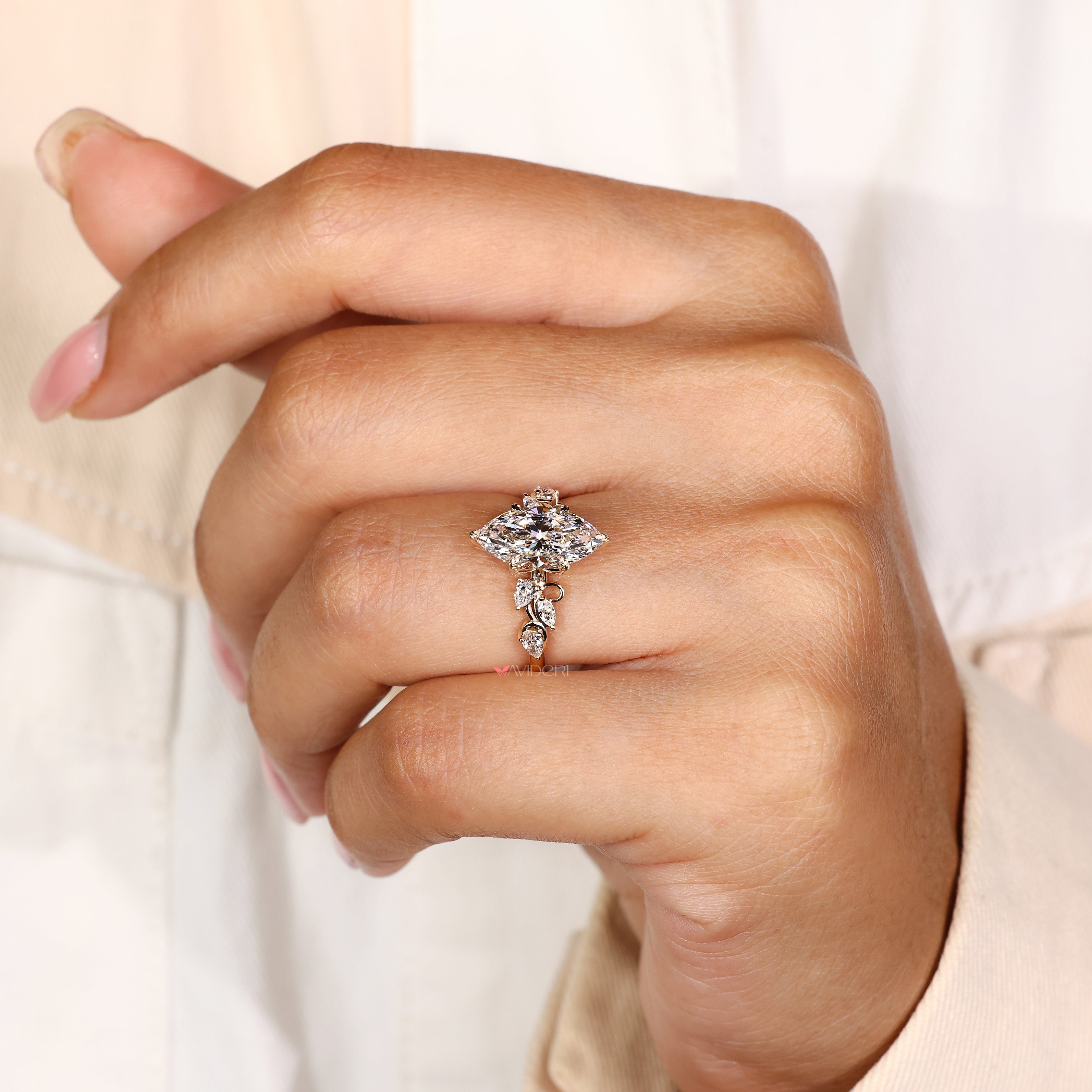 IGI certified marquise diamond ring with pear side stones
