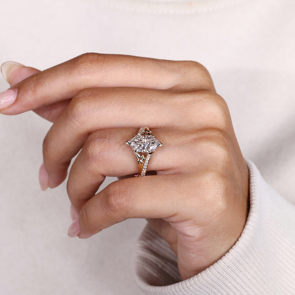 Marquise diamond ring with four leaf style prongs.
