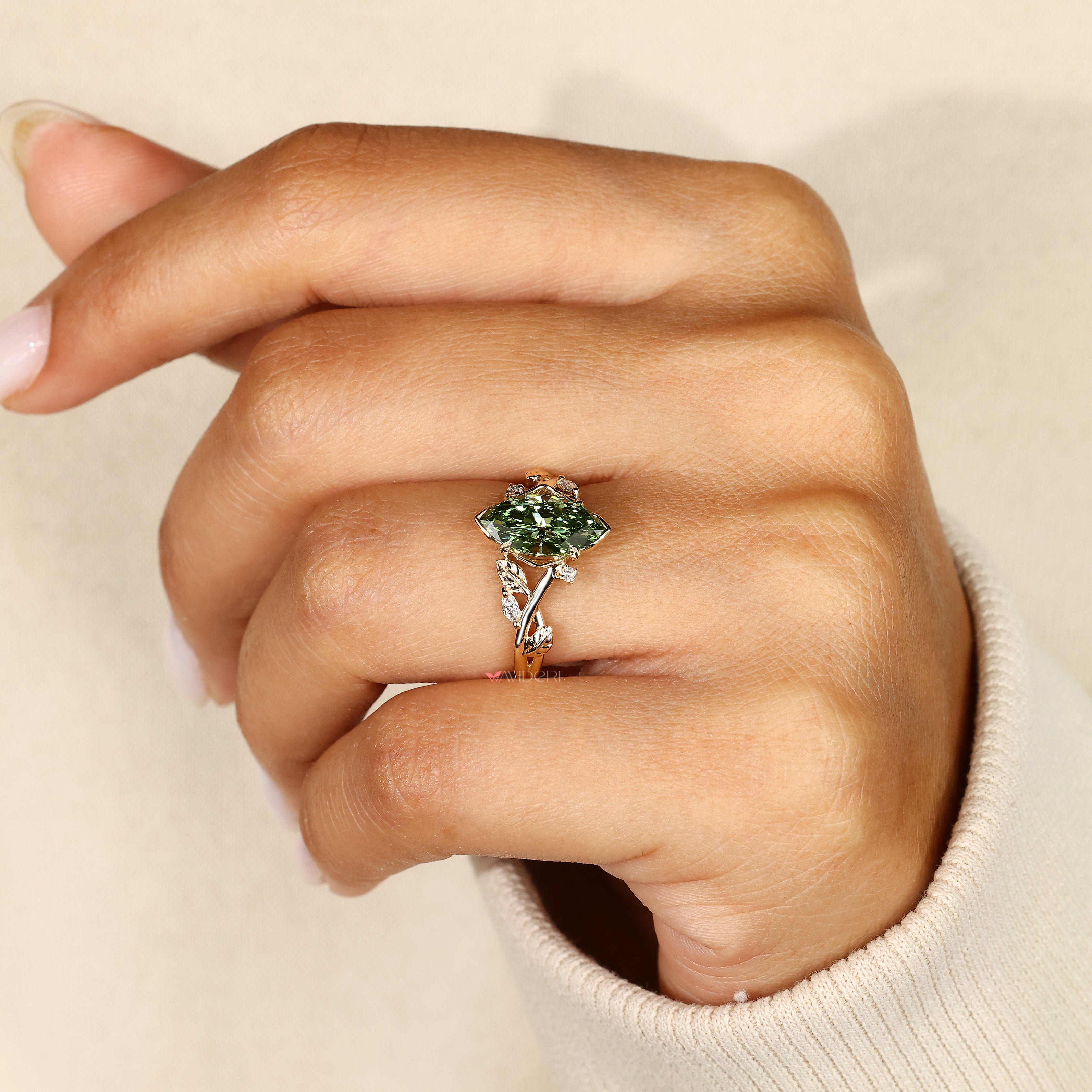 Lab grown green marquise diamond engagement ring.
