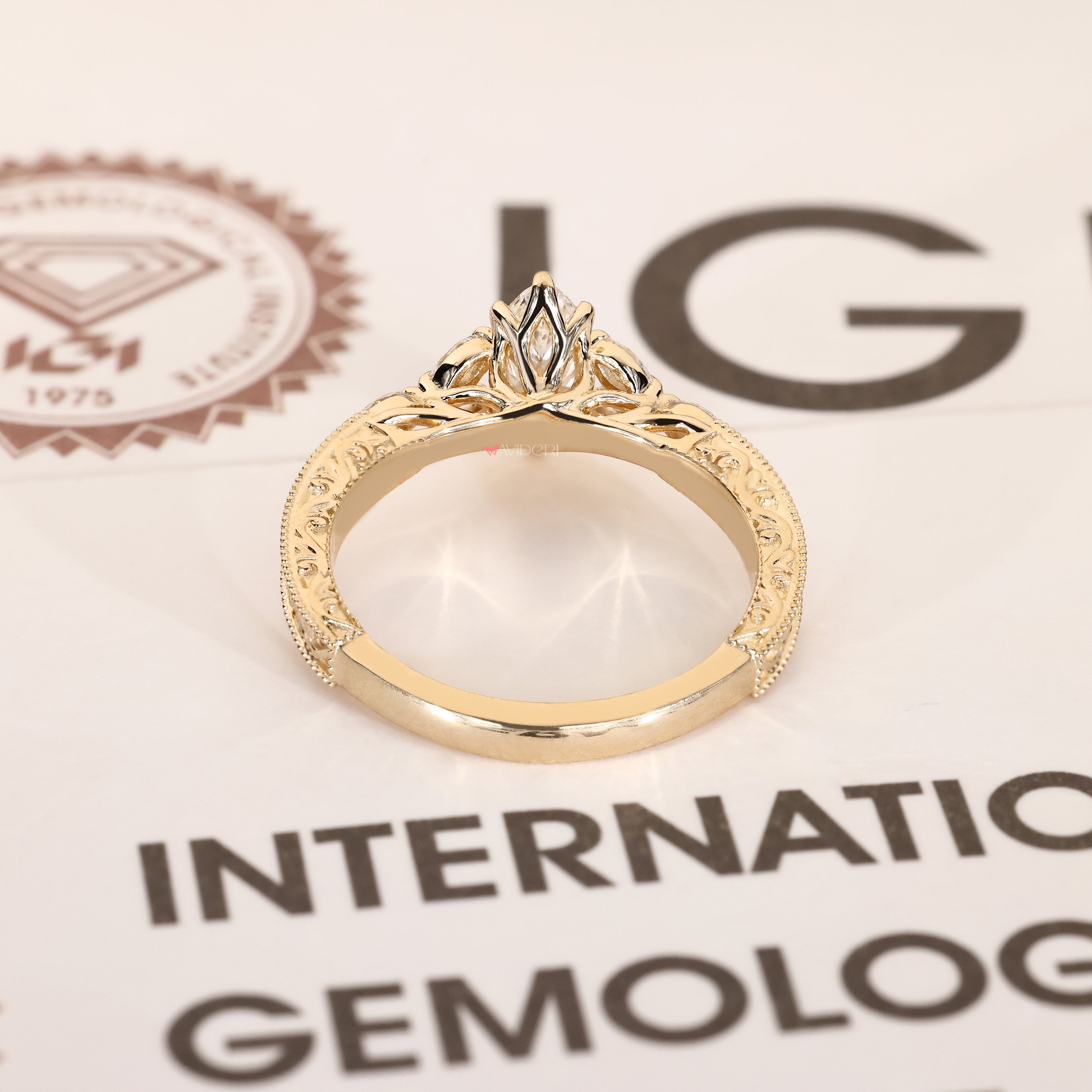 Milgrain marquise ring with tulip basket setting.

