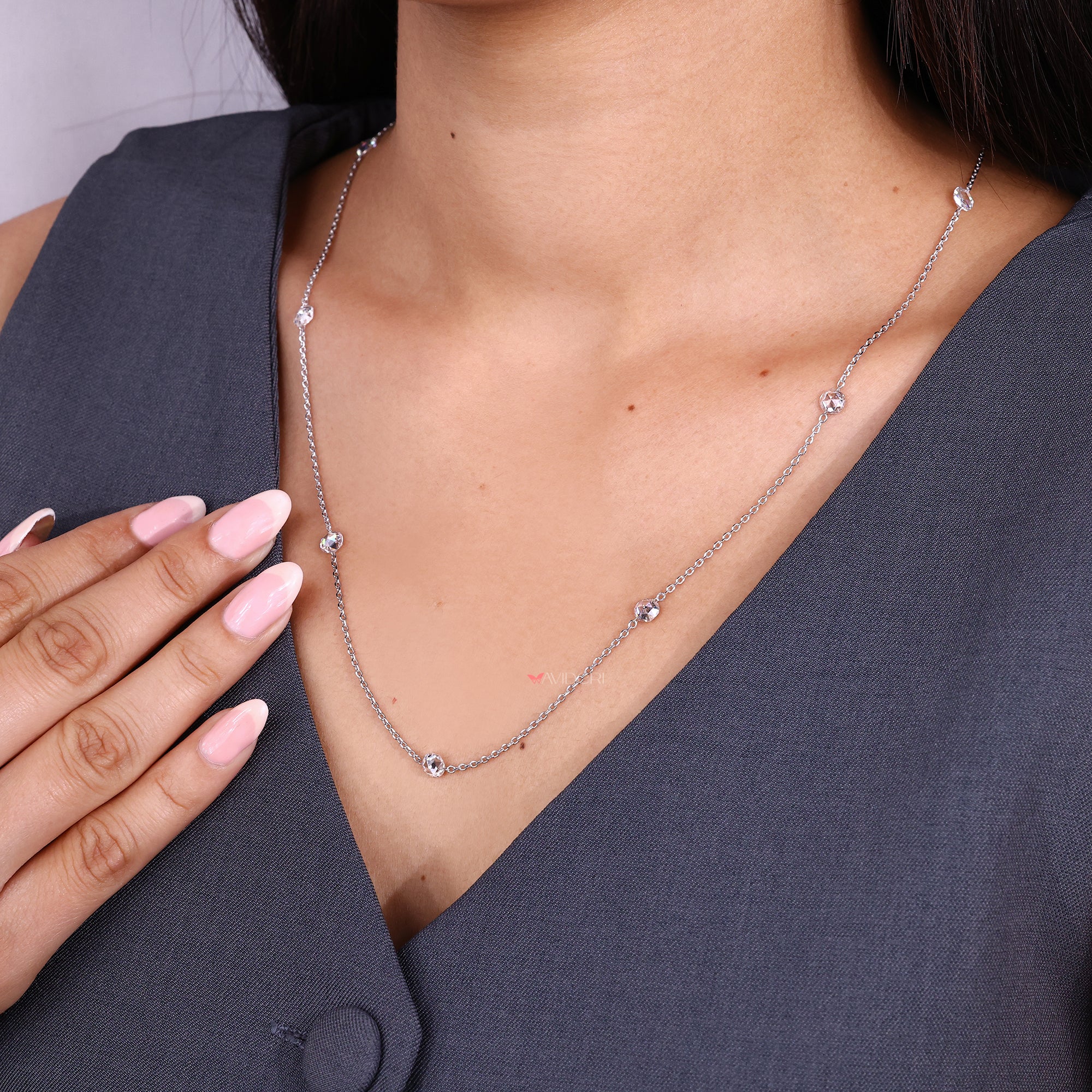 Handmade pendant on a delicate diamond chain.