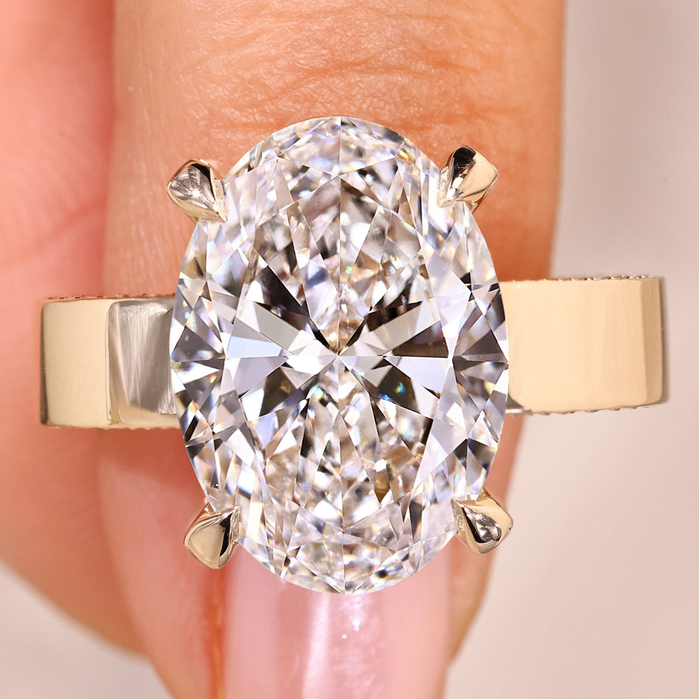 Oval cut diamond ring hidden halo pave style.
