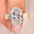 Oval cut diamond ring hidden halo pave style.
