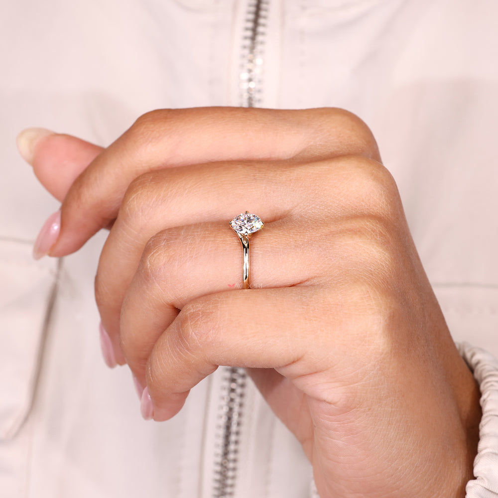 
Handmade round cut diamond ring with solitaire setting style.
