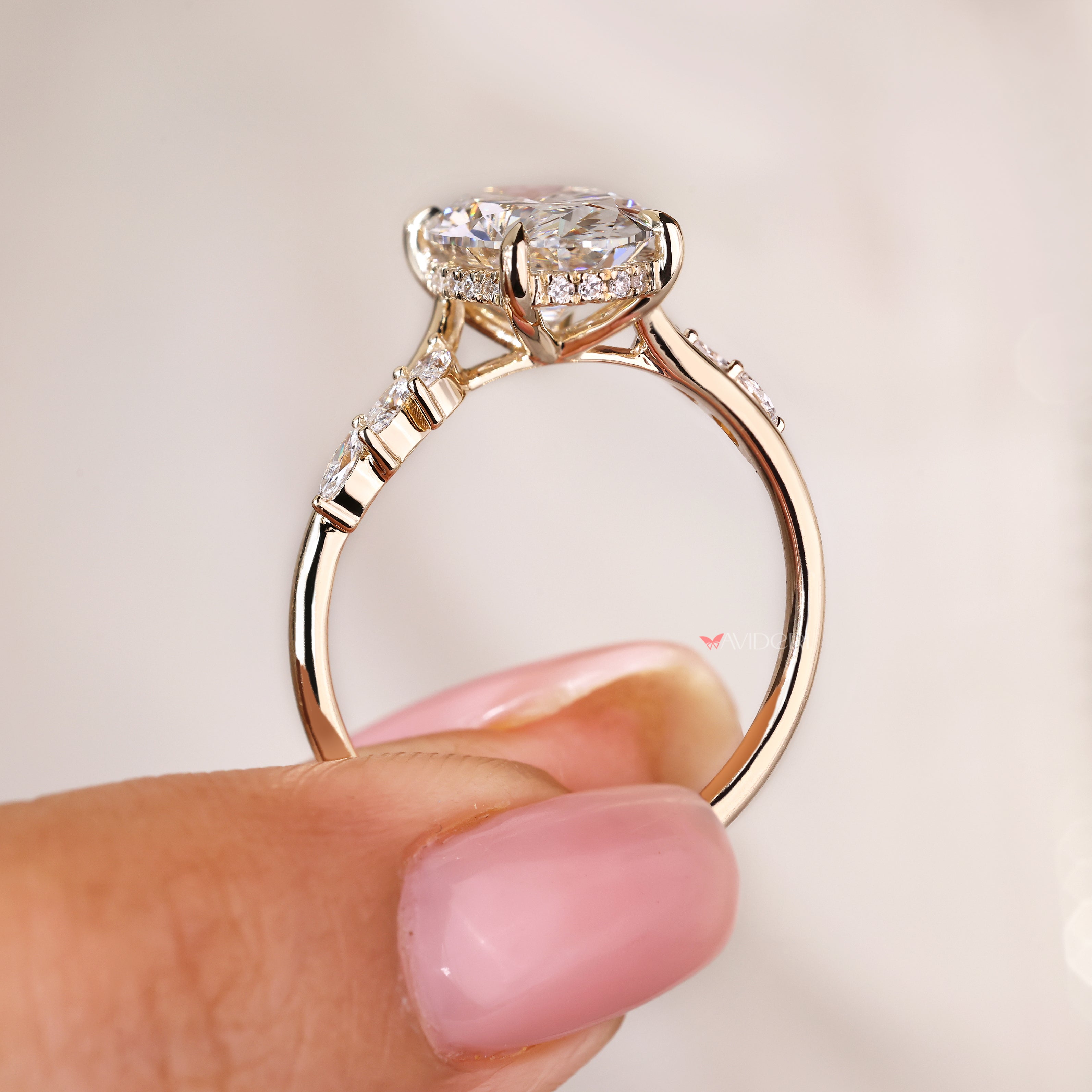 IGI certified oval ring with marquise side stone details
