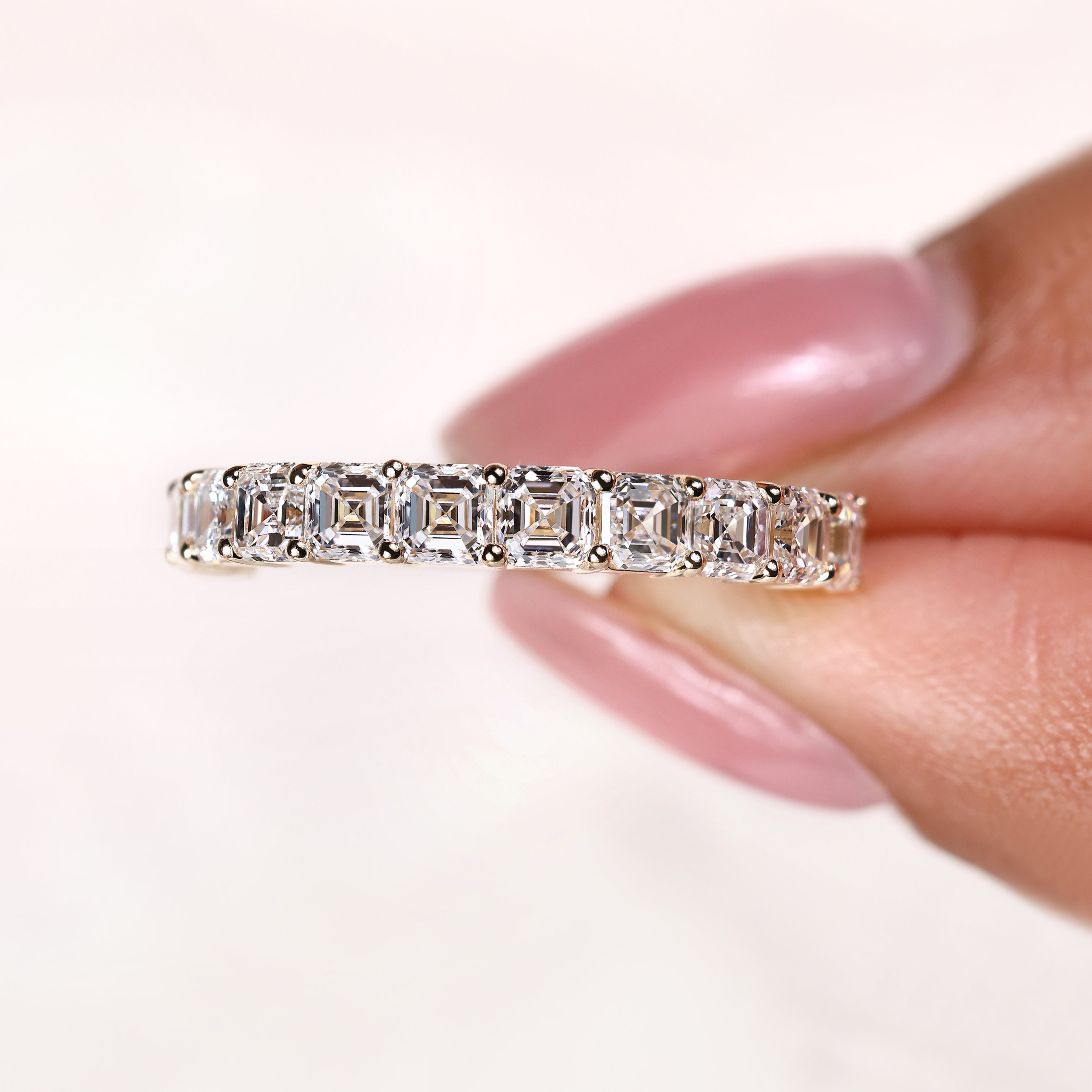 Asscher cut diamond band with evenly spaced prong setting
