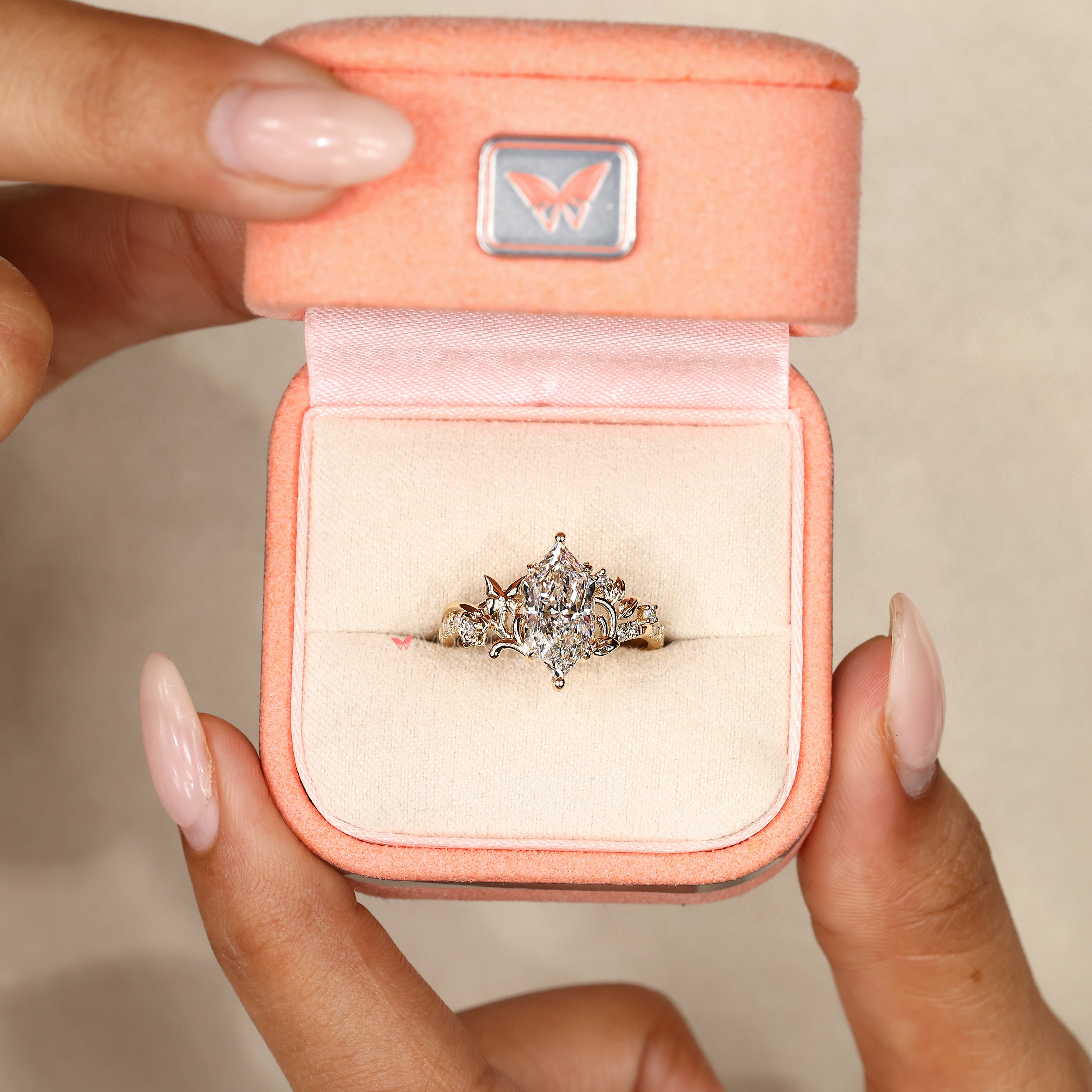 Nature inspired marquise ring with butterfly detail.
