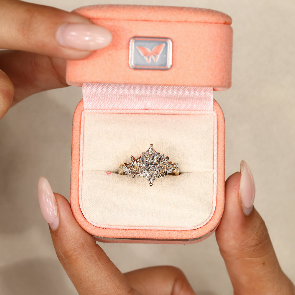 Nature inspired marquise ring with butterfly detail.
