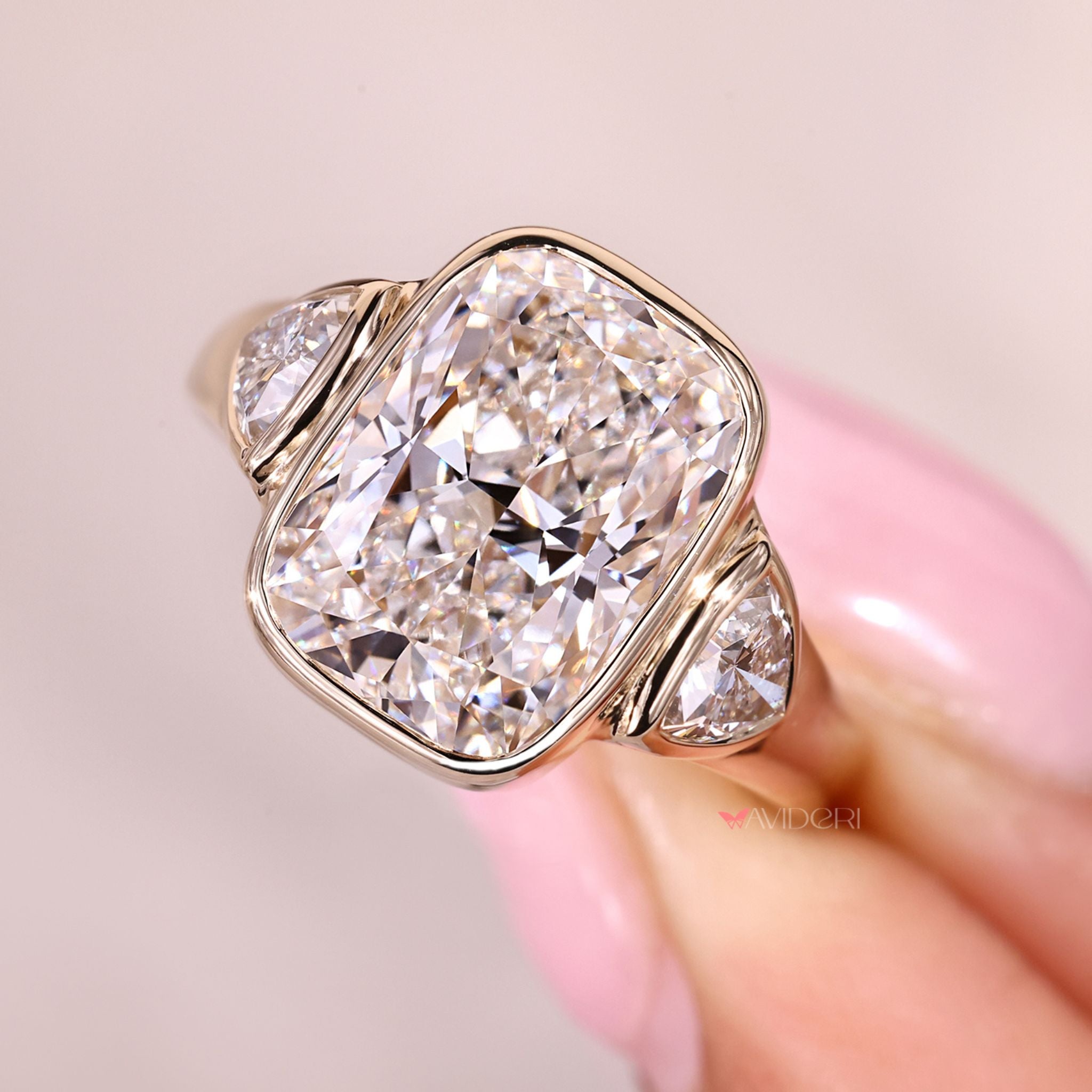 Three stone cushion cut ring with tapered shank design.