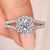Round diamond engagement ring split shank halo.

