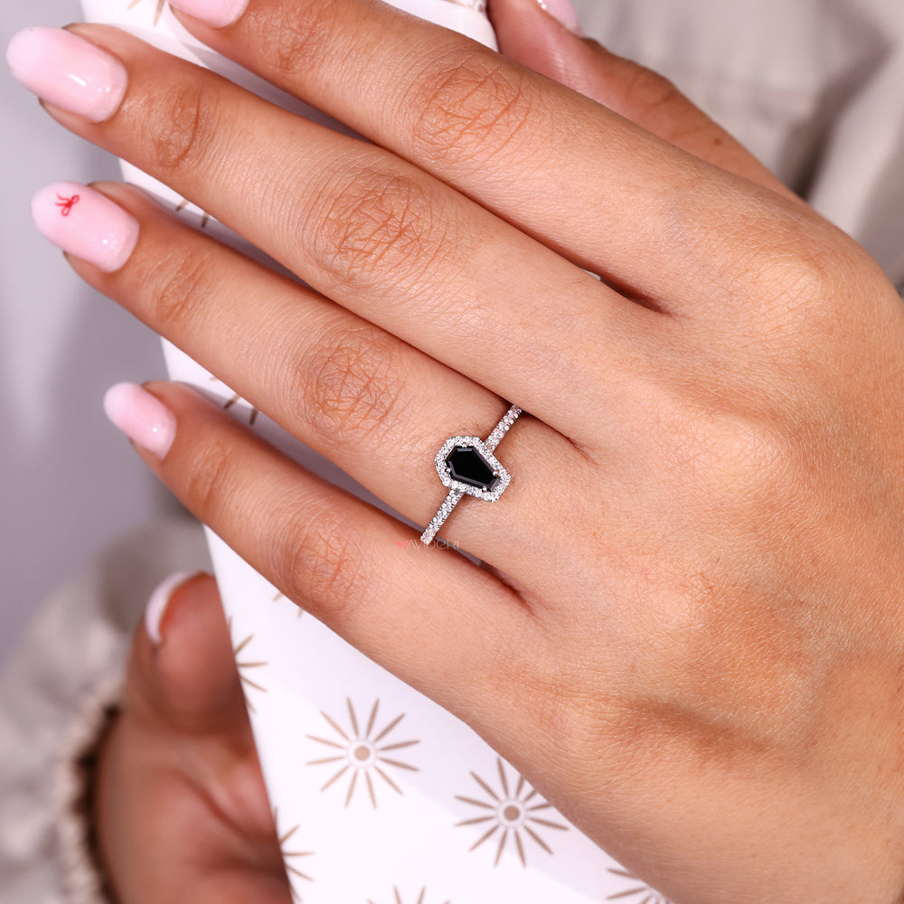 Coffin cut ring with round moissanite halo setting.