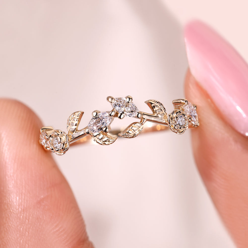Avideri curved nature inspired wedding band with marquise and round diamonds.