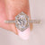 Oval cut diamond ring halo and pave style.