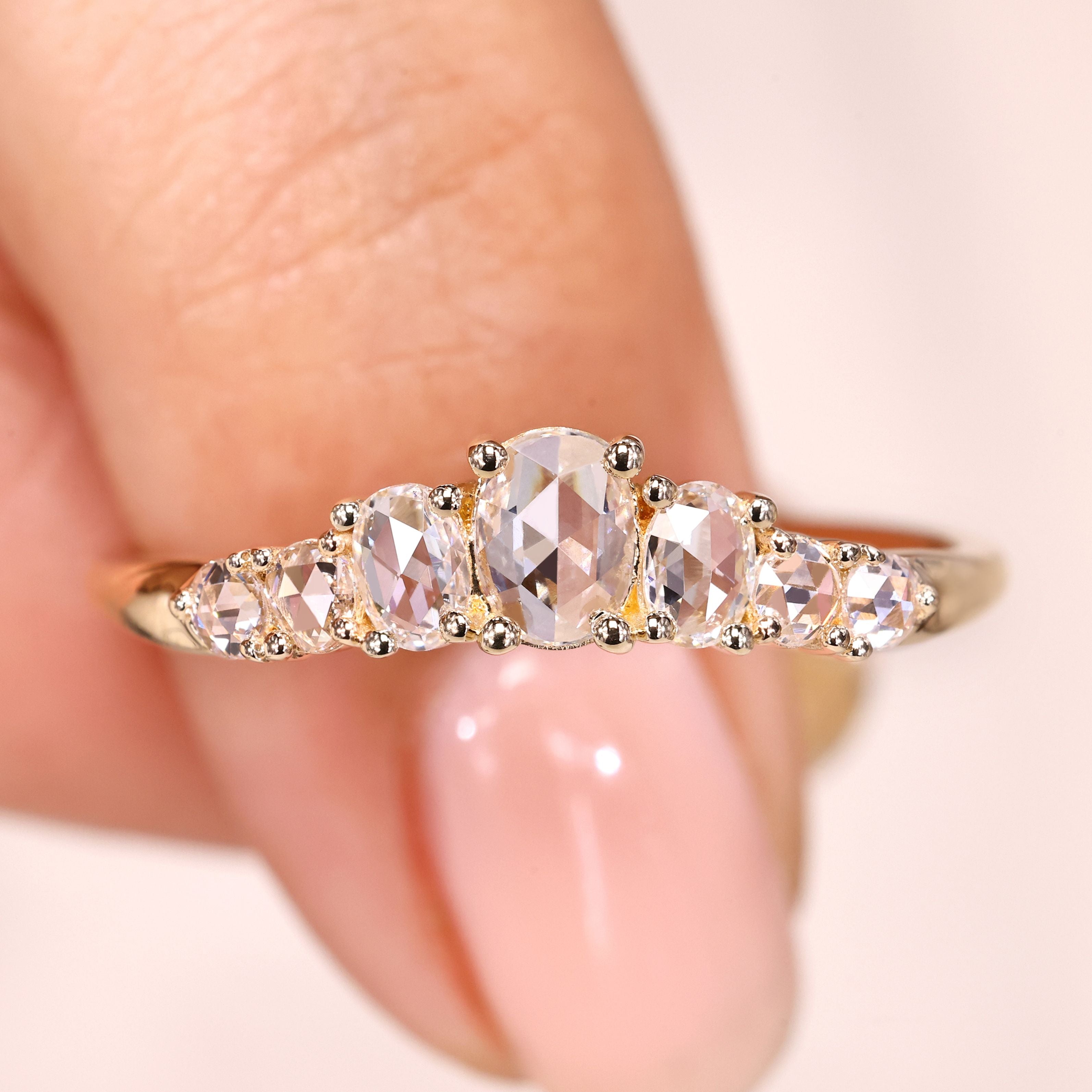 Half eternity band with oval rose cut diamonds.
