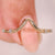 Round diamond curved wedding band with milgrain setting.