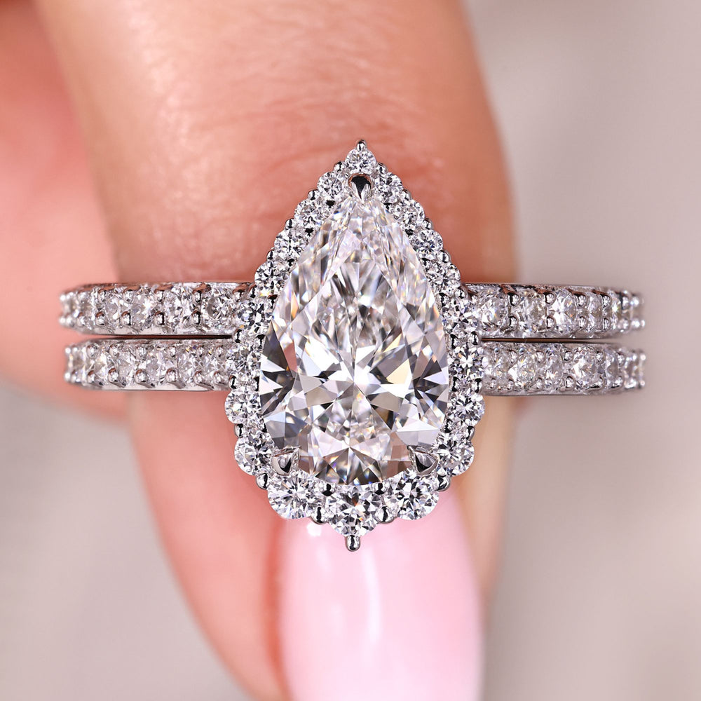 Pear diamond engagement ring with matching band.
