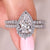 Pear diamond engagement ring with matching band.