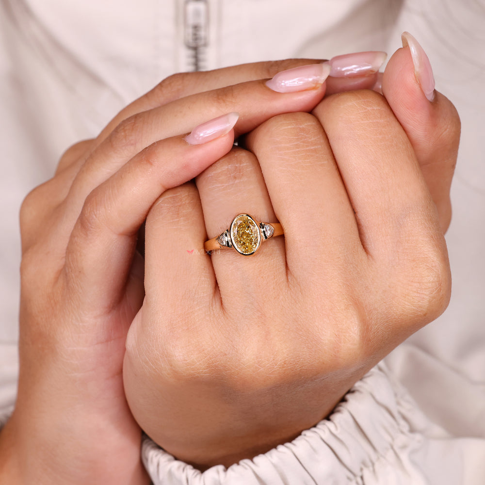 Three stone oval diamond ring bezel style.
