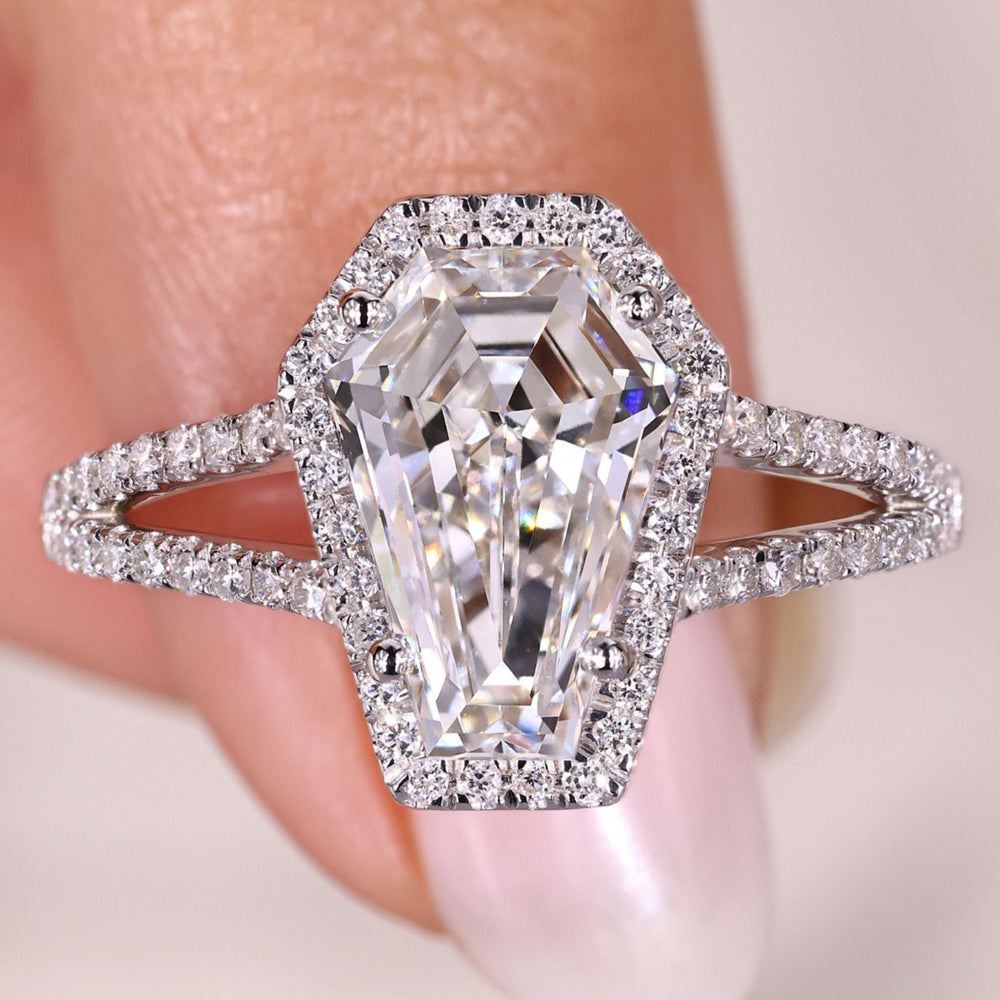 Coffin diamond ring with pave split shank band.
