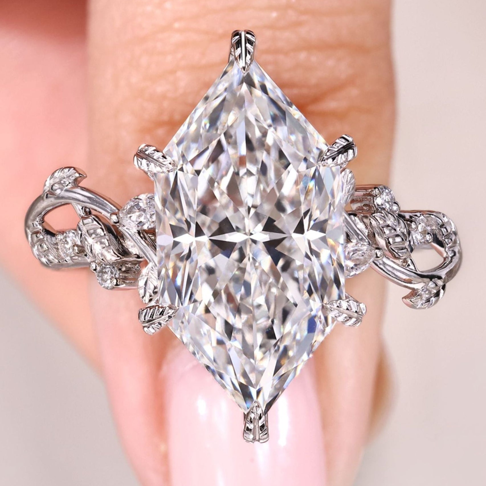 Dutch marquise diamond ring with side stones.
