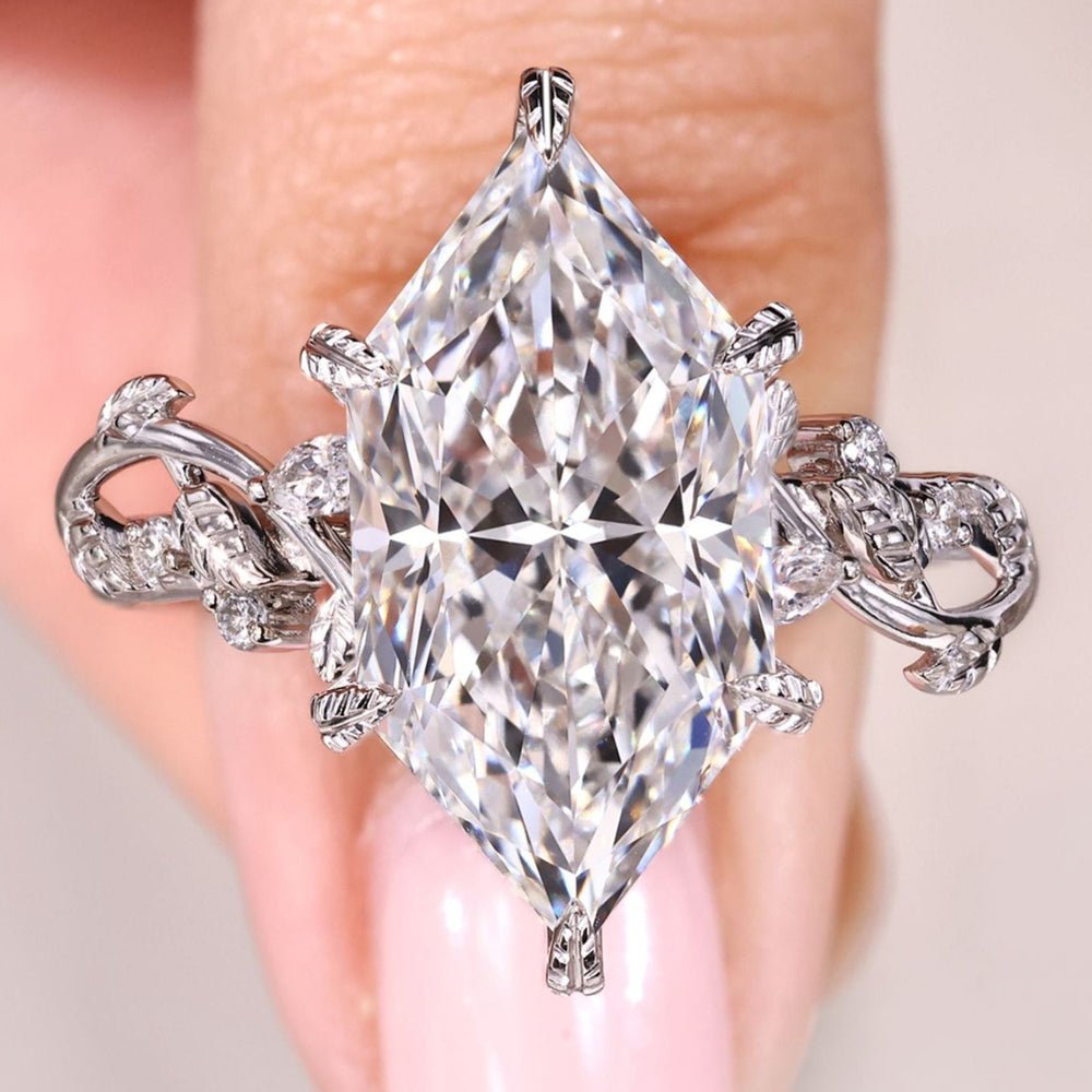 Dutch marquise diamond ring with side stones.
