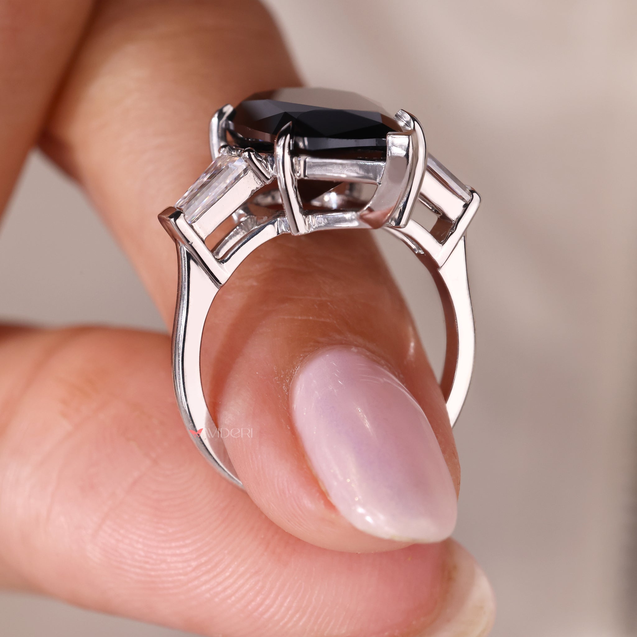 white gold engagement ring with pear cut moissanite and v-prong setting.