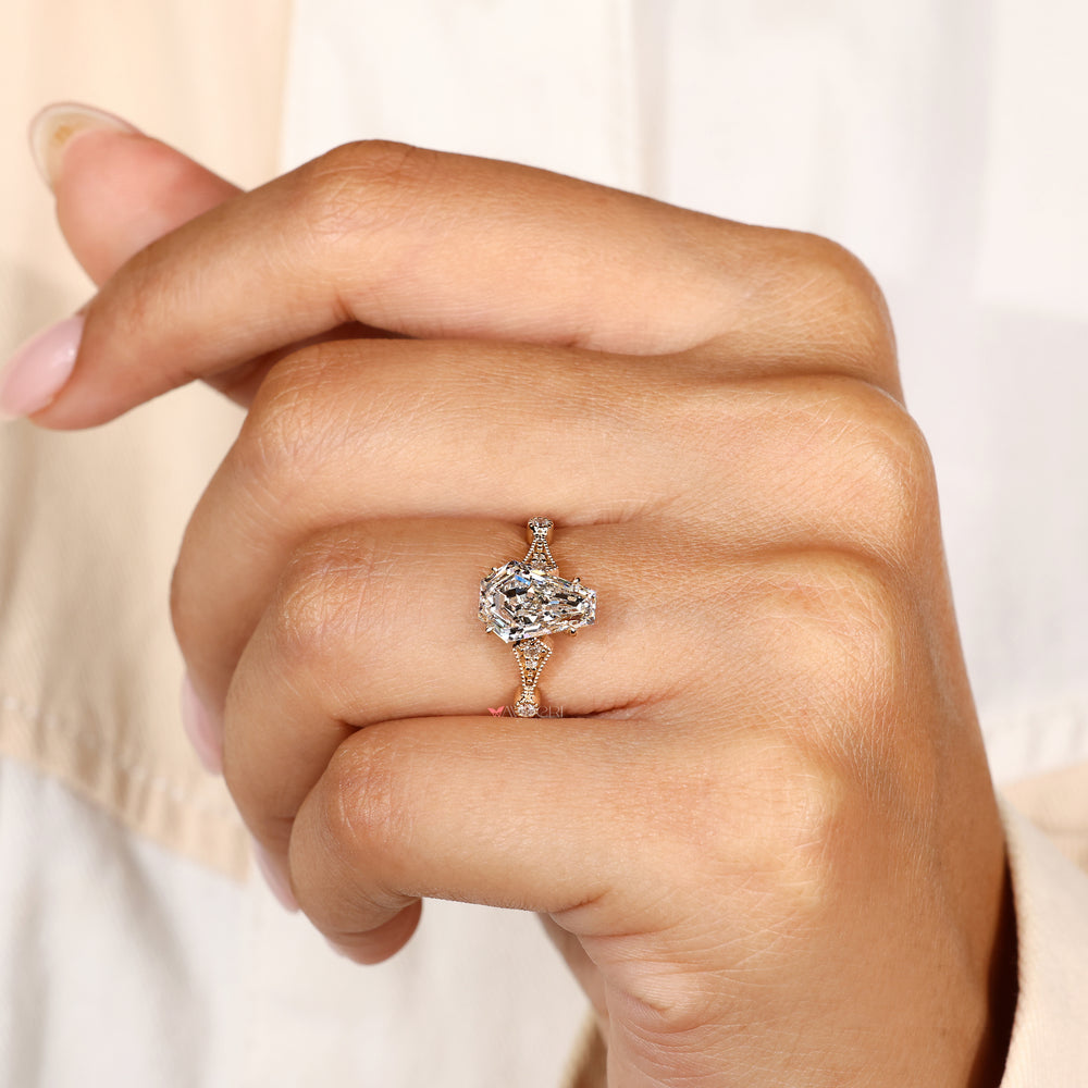 Handmade coffin cut engagement ring with cathedral setting
