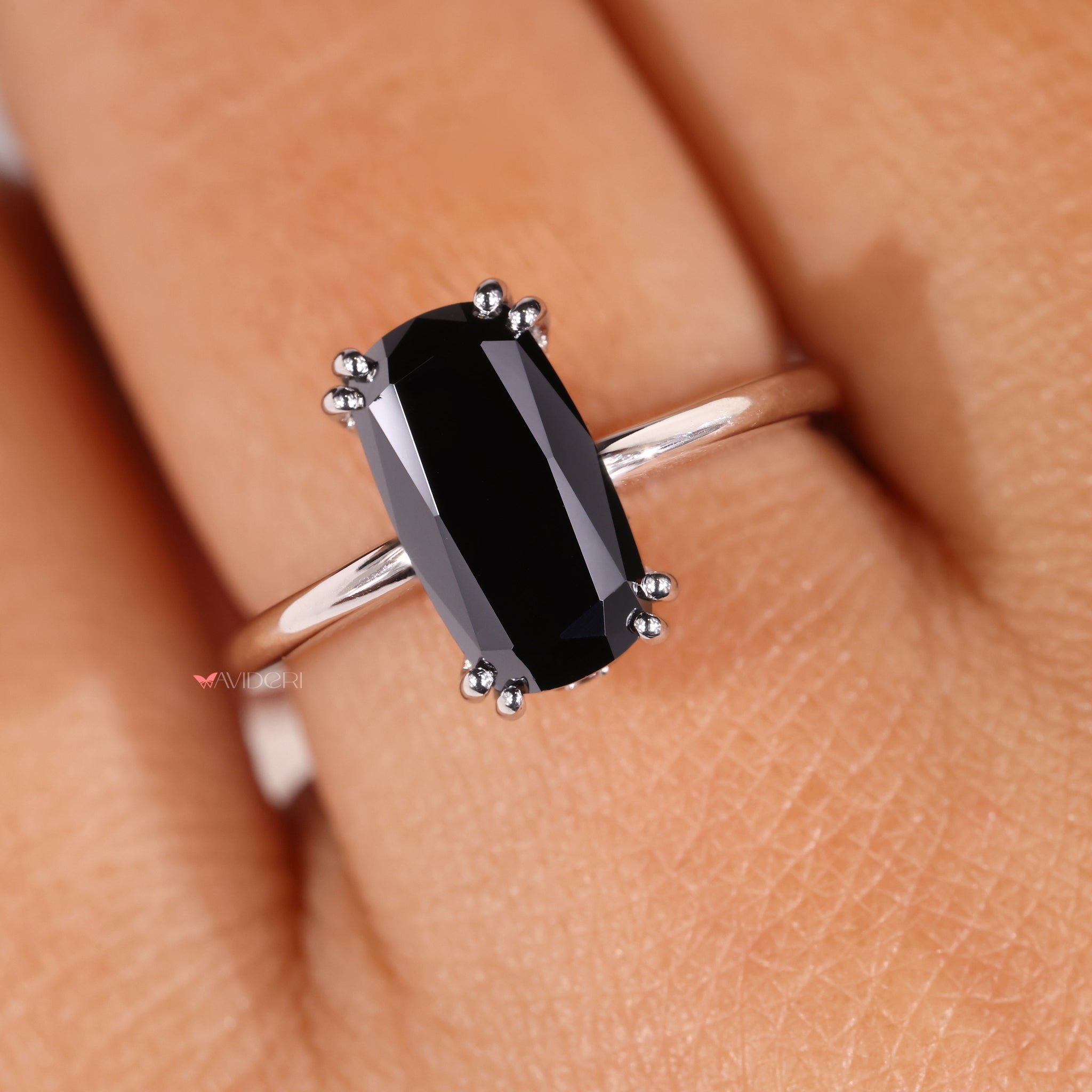 Double claw prong setting holds the center stone with strength and grace.
