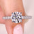Round diamond engagement ring with hidden halo.
