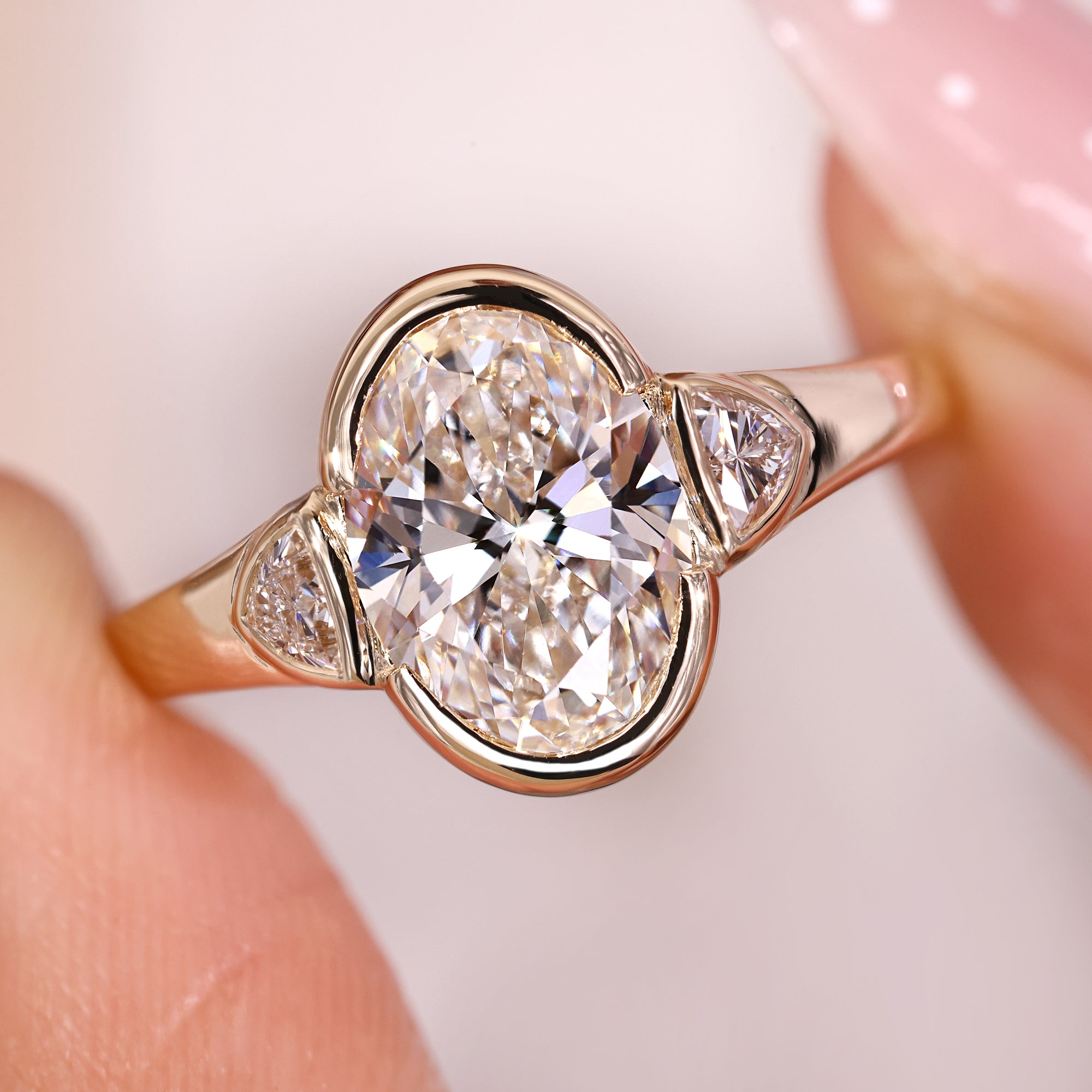 Tapered shank ring with cathedral setting ring details.