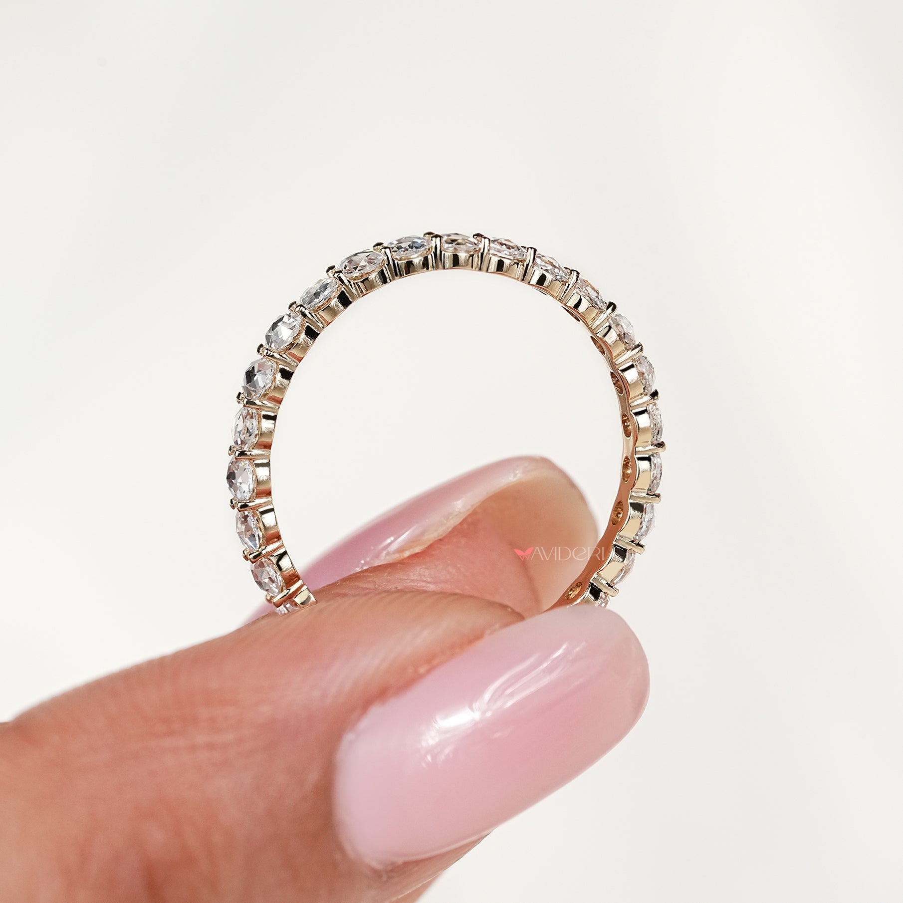 Round rose diamond eternity ring with handcrafted prong setting
