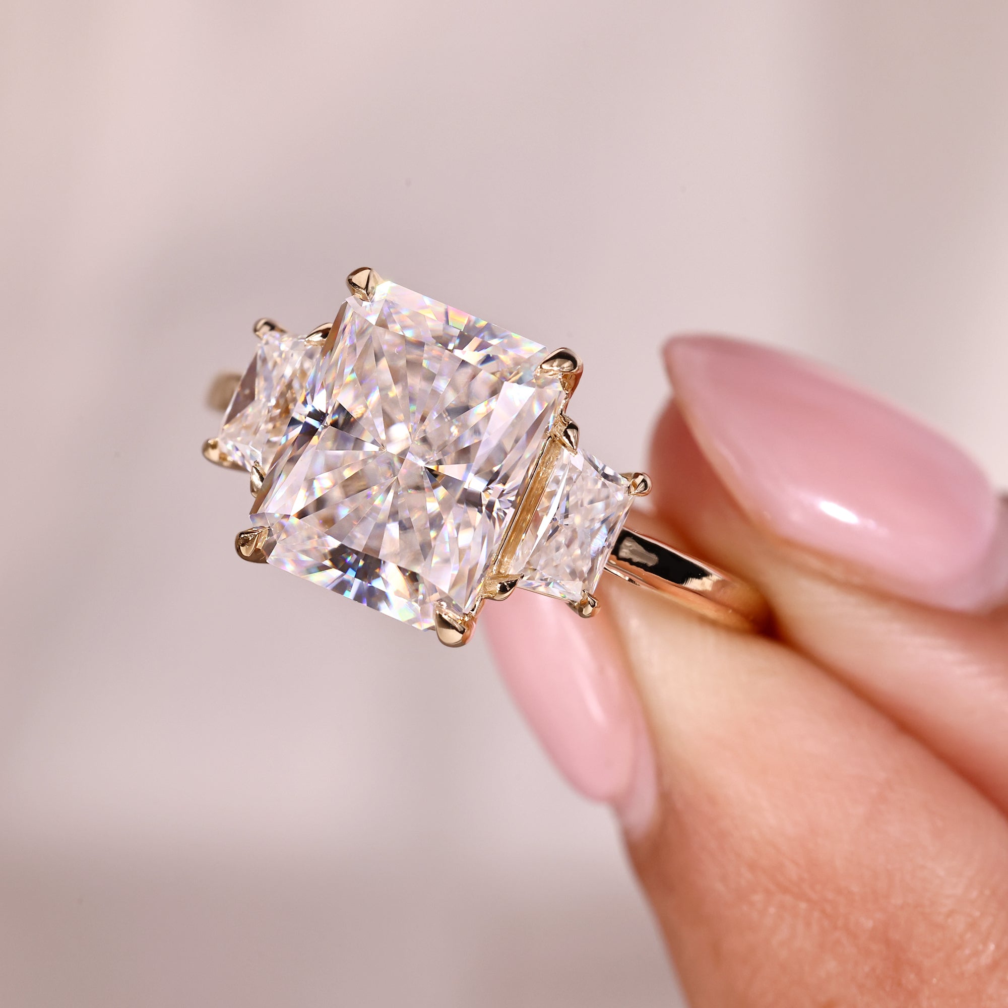 Four prong claw setting ring with radiant cut moissanite.